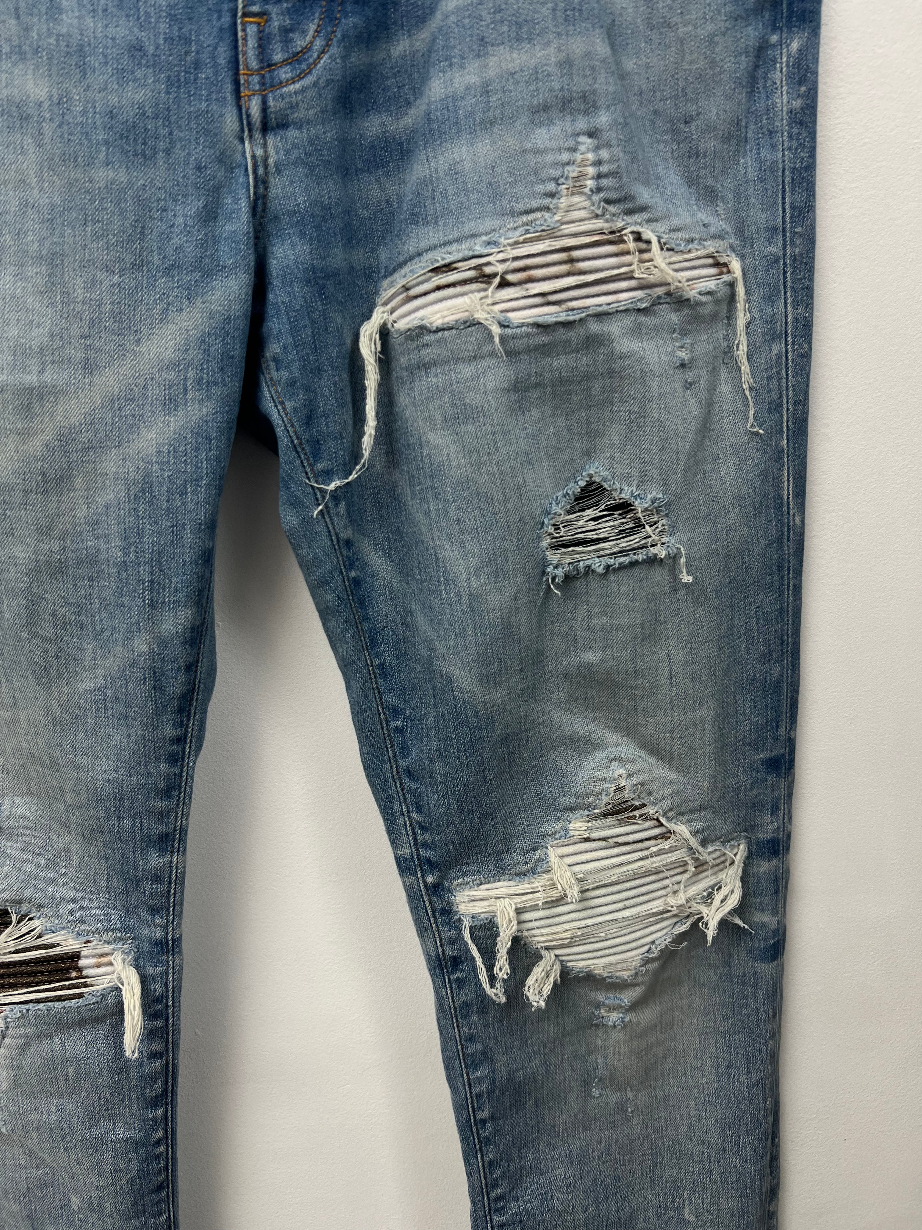 Amiri MX1 Light Wash Marble Patch Jeans
