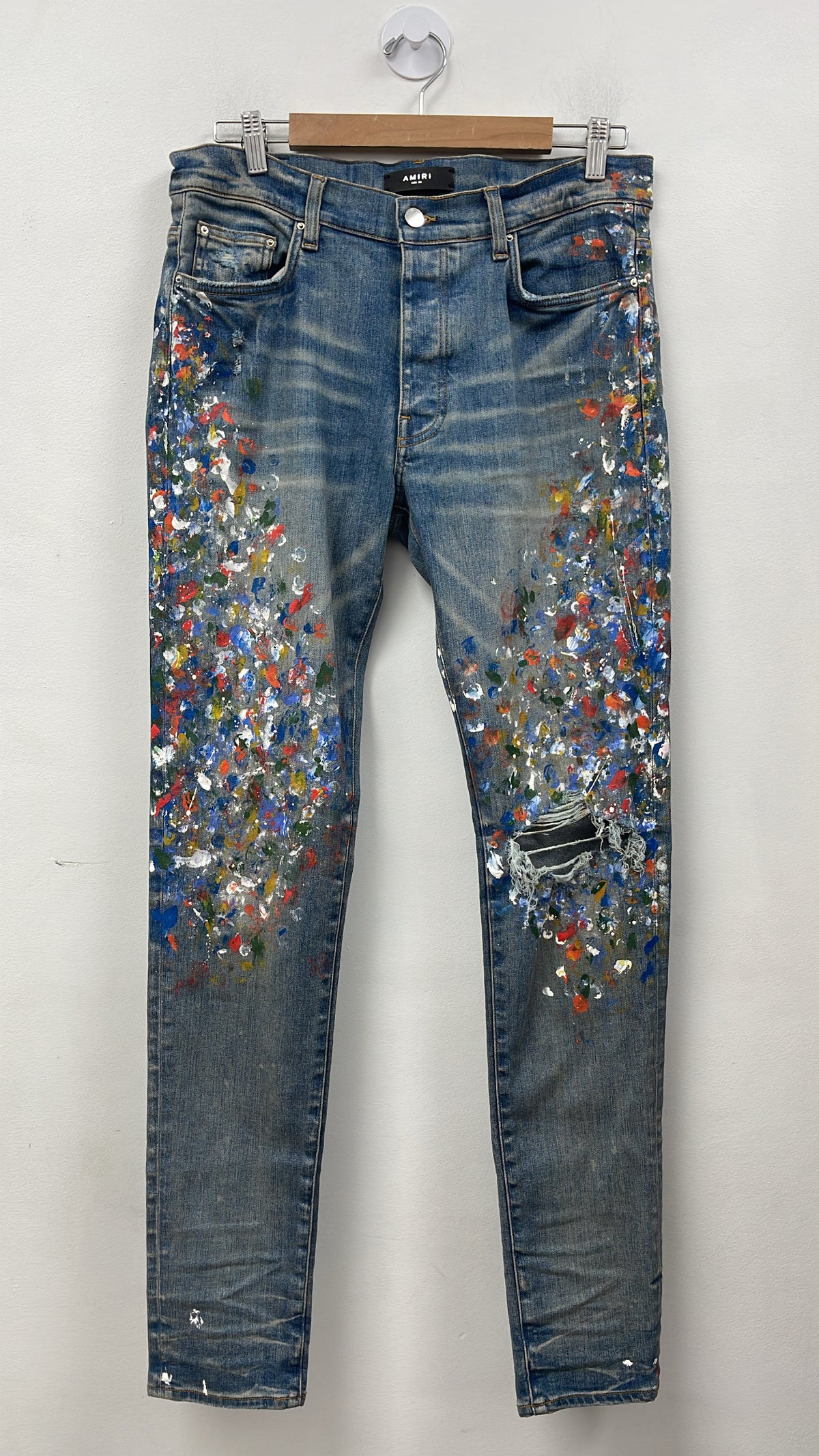 Amiri Light Wash Paint Splatter Knee Ripped Jeans