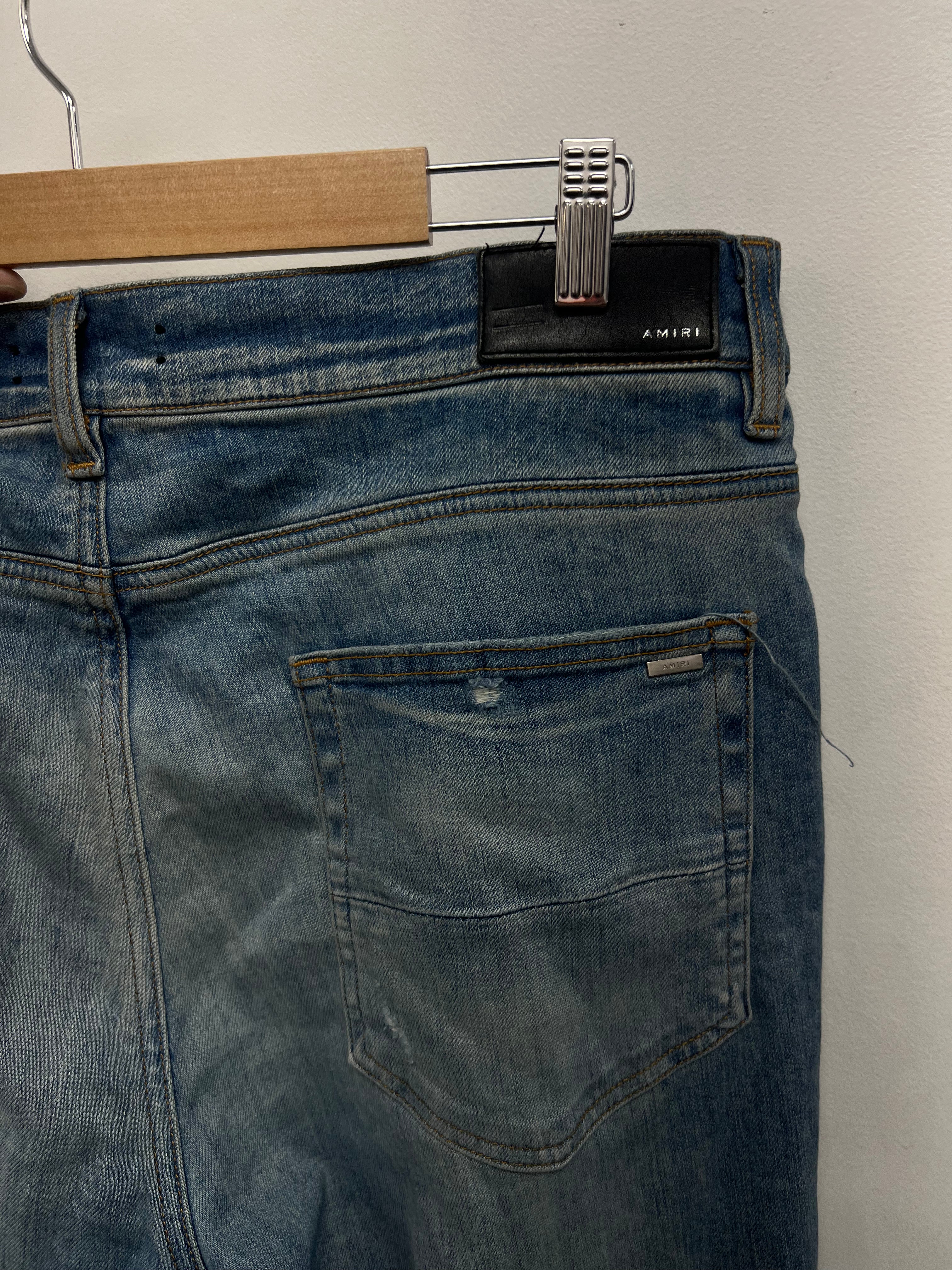 Amiri MX1 Light Wash Marble Patch Jeans