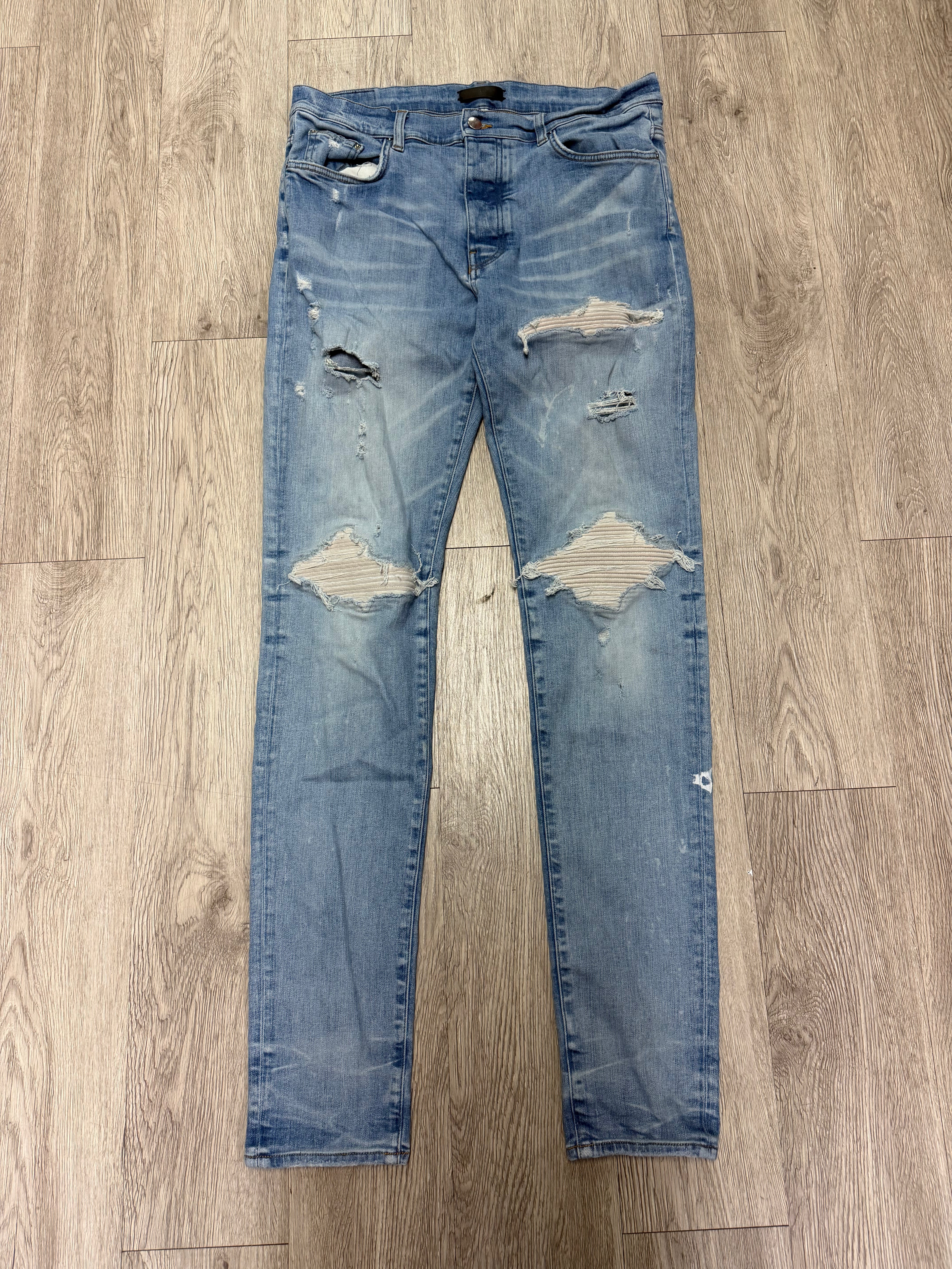 Amiri MX1 Light Wash White Patch Jeans