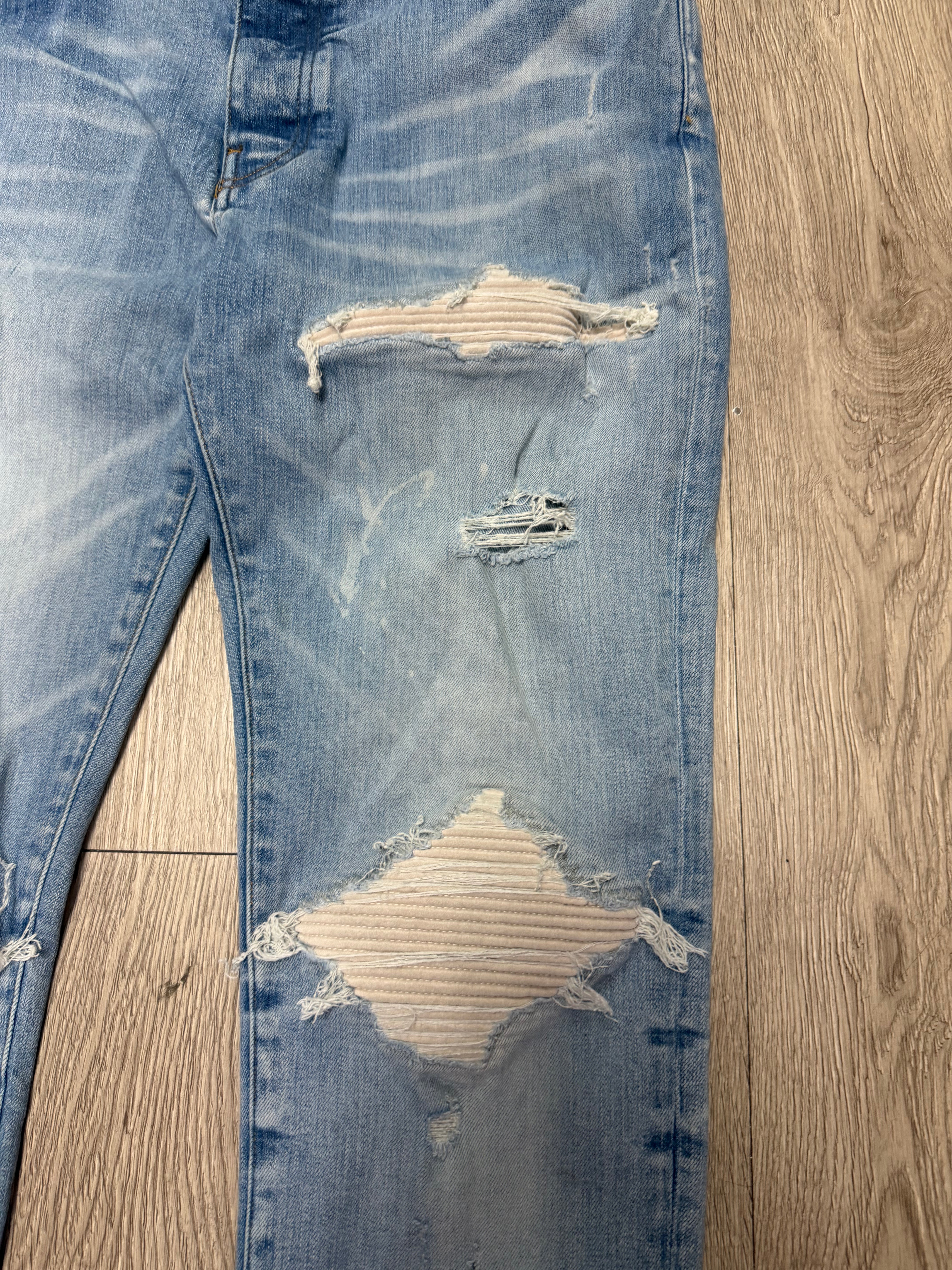 Amiri MX1 Light Wash White Patch Jeans