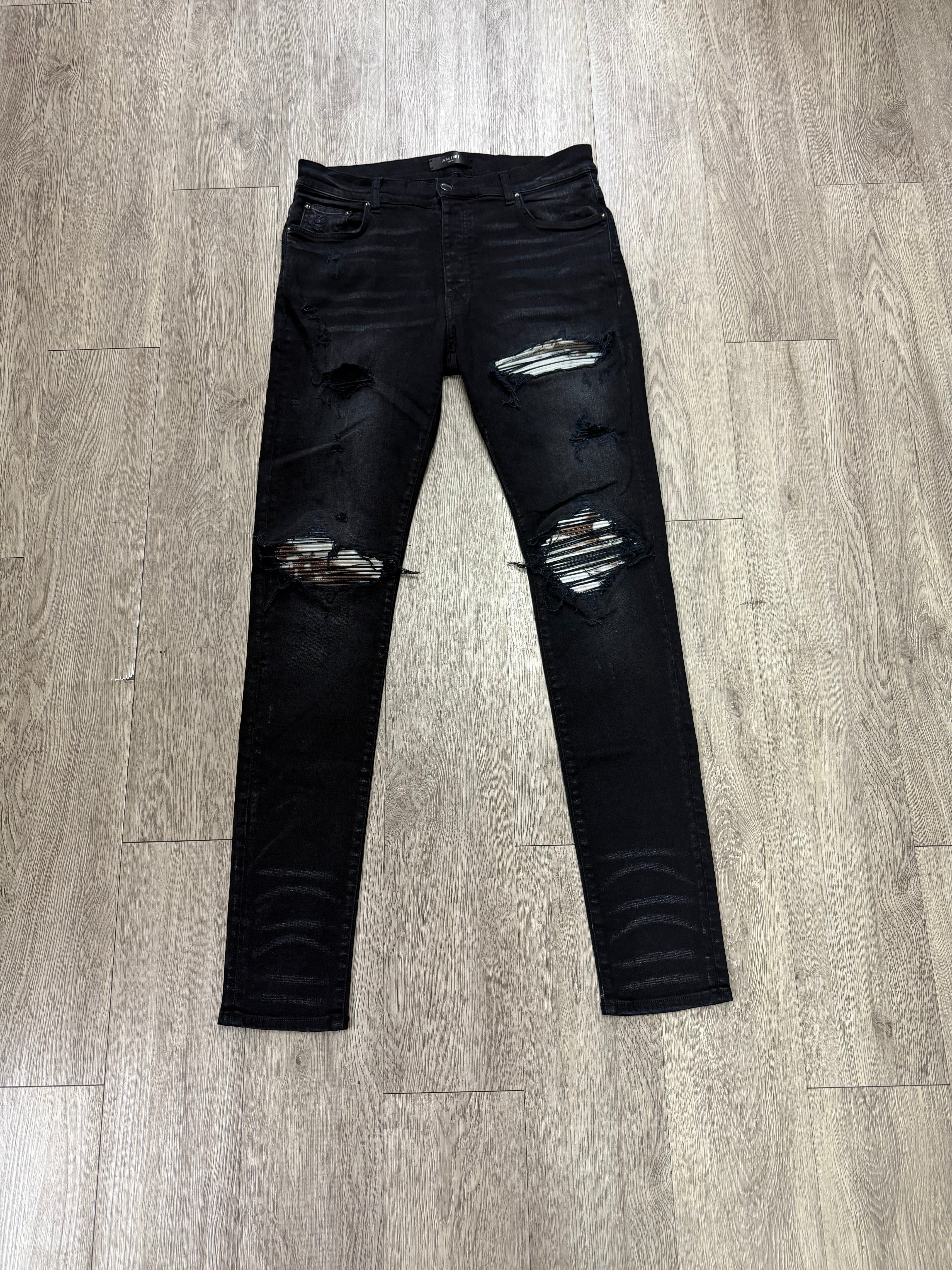 Amiri MX1 Black Wash Marble Patch Jeans