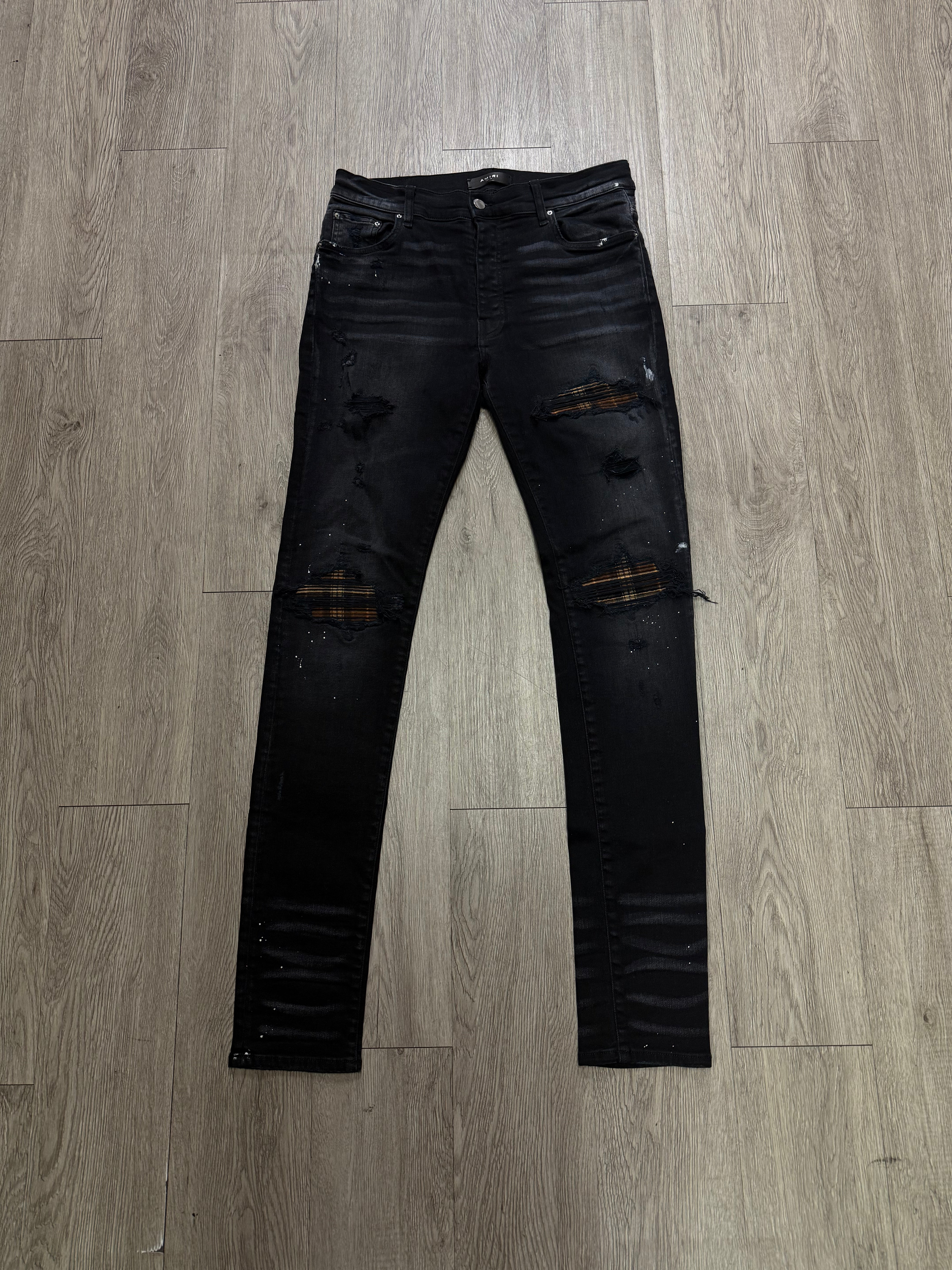Amiri MX1 Black Wash Brown Plaid Patch Jeans