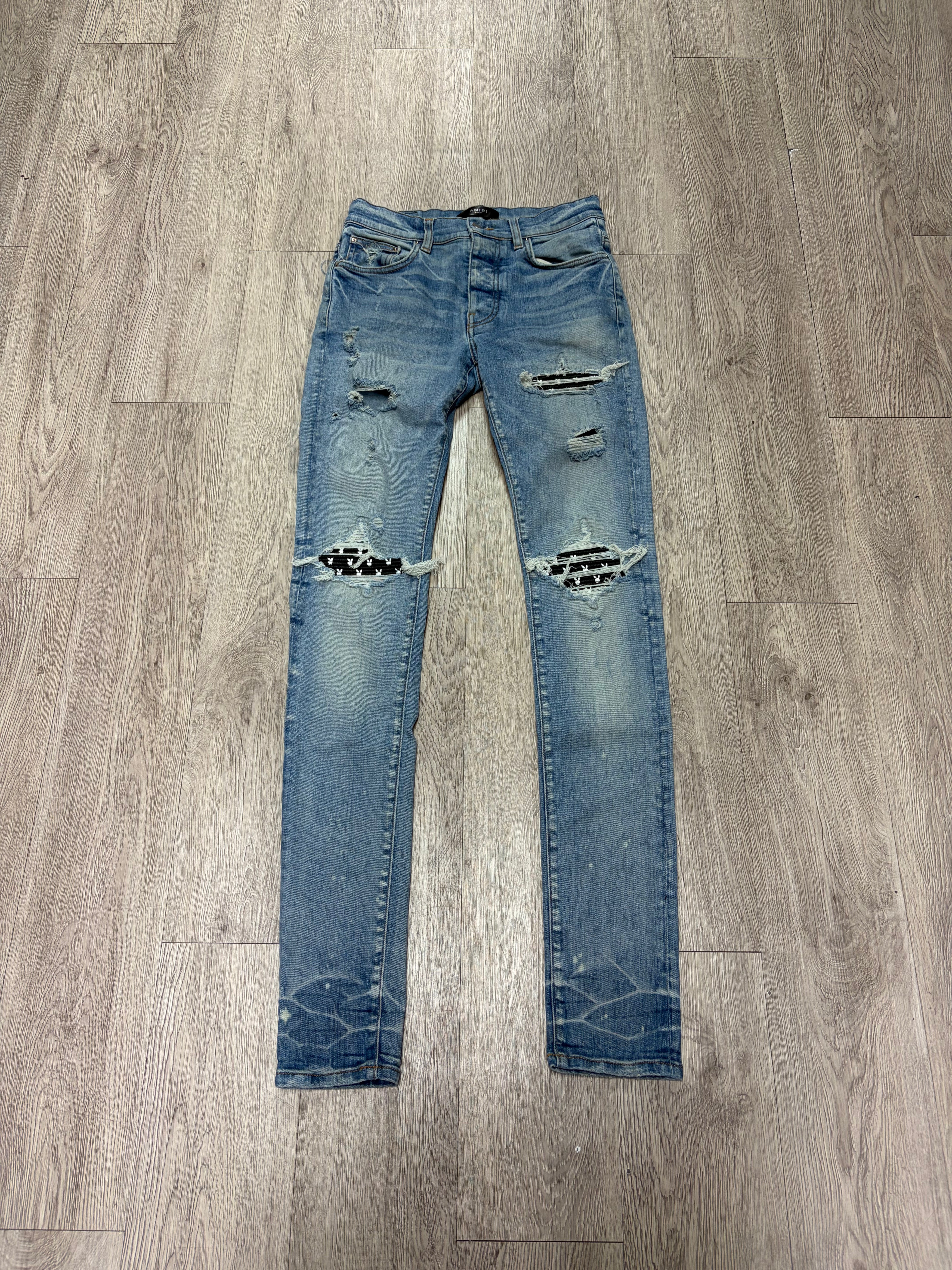 Amiri MX1 Light Wash Black Playboy Patch Jeans