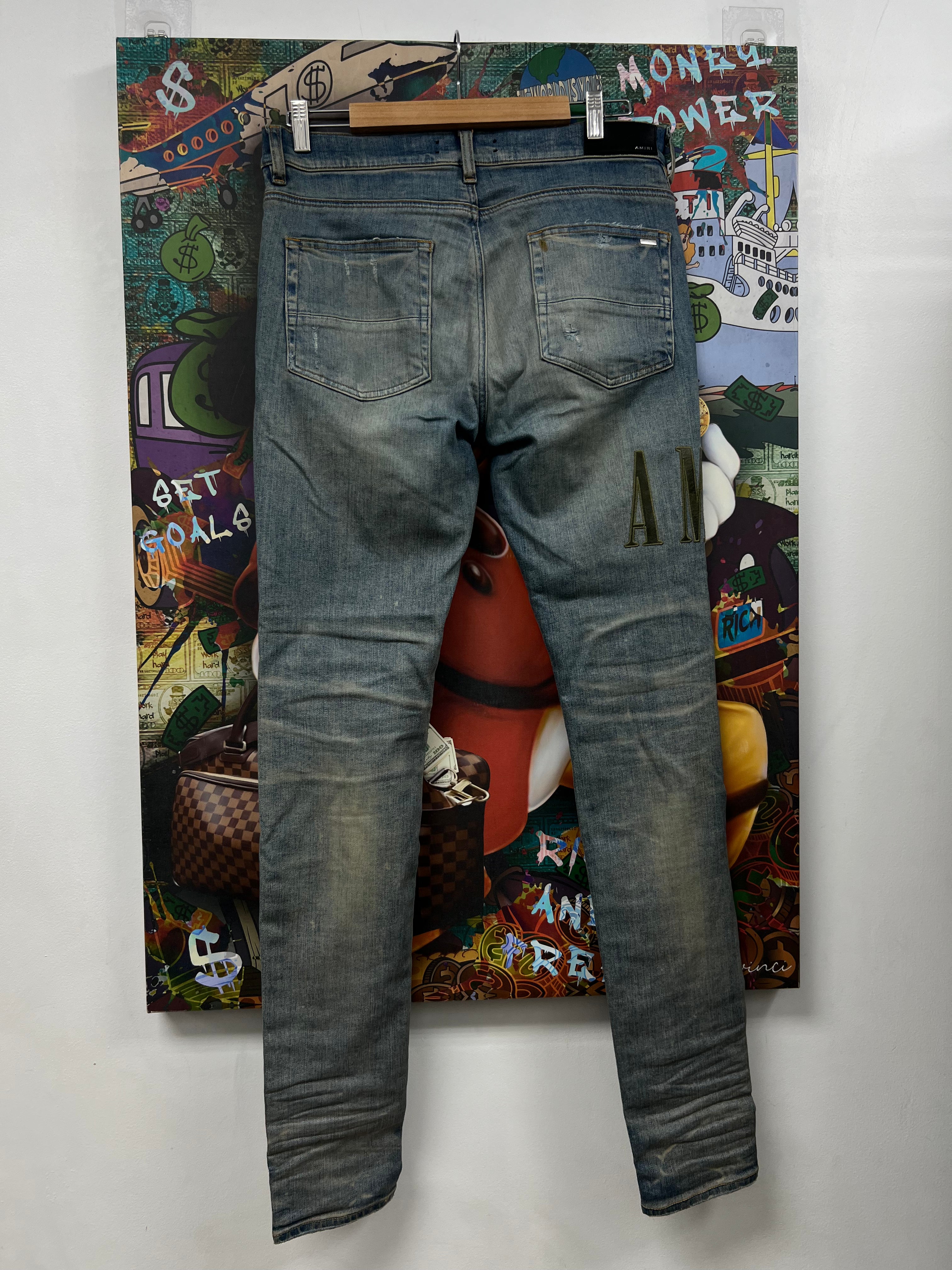 Amiri Light Wash Camo Side Logo Jeans