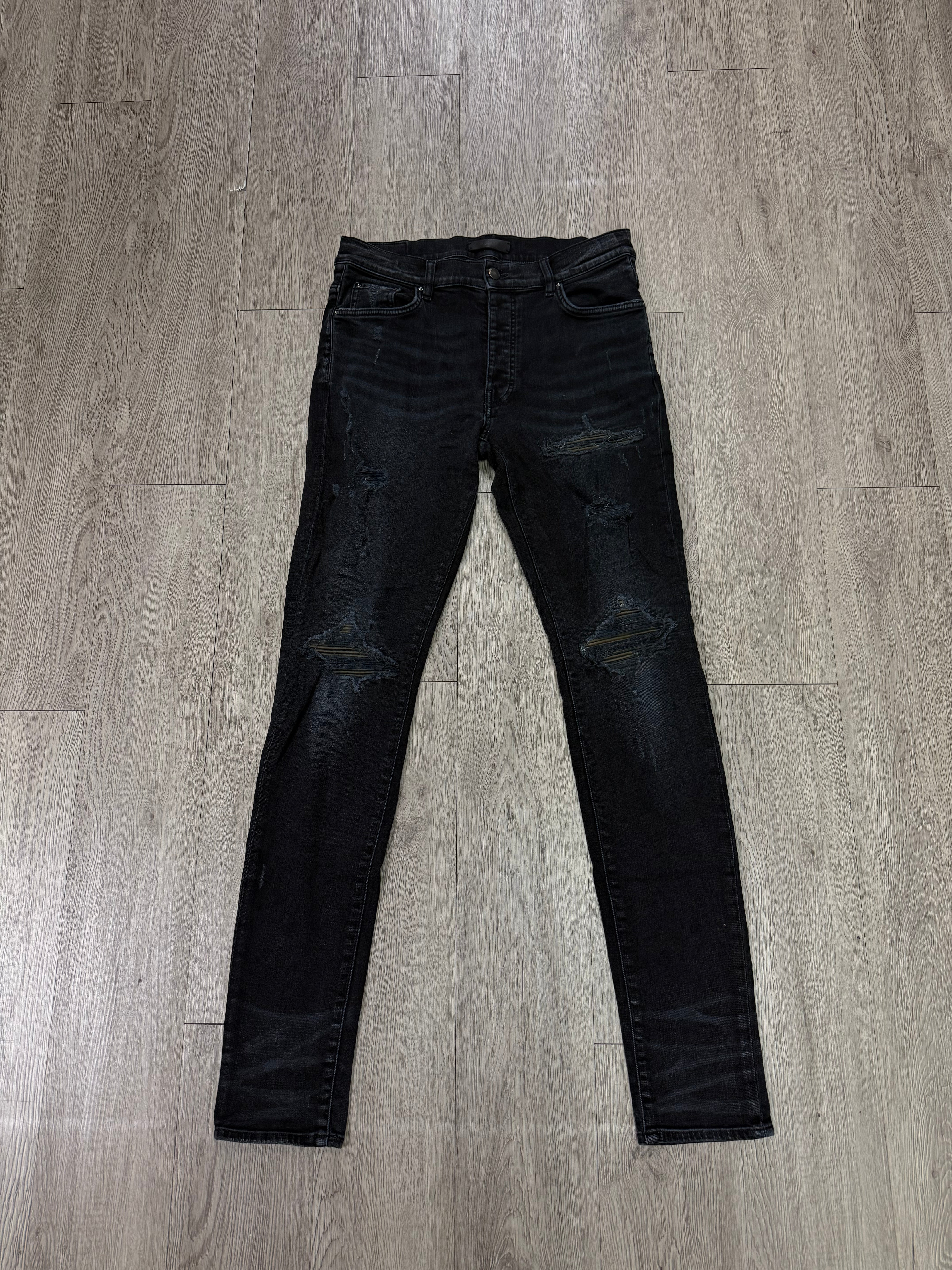Amiri MX1 Black Wash Camo Leather Patch Jeans