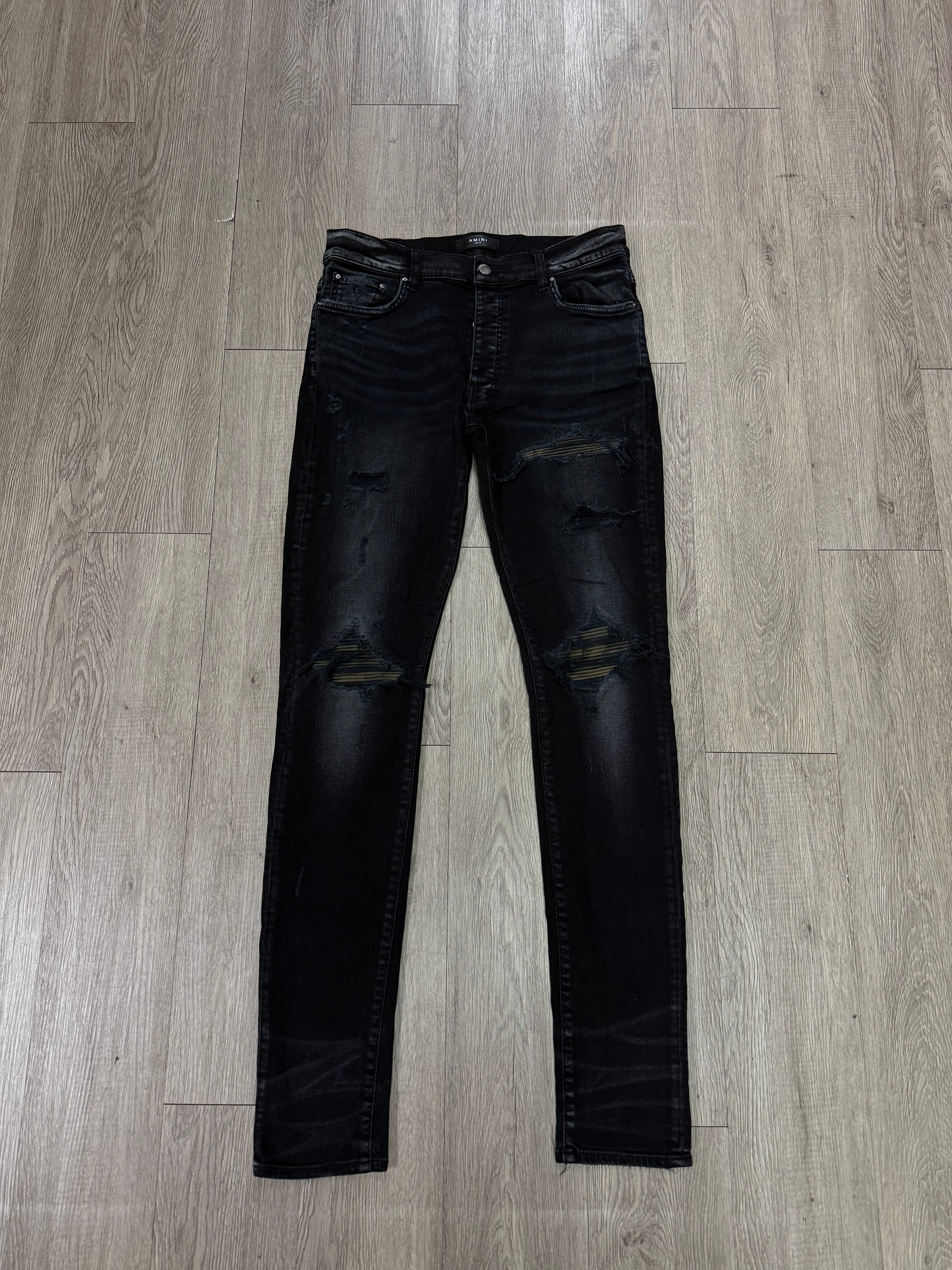 Amiri MX1 Black Wash Camo Leather Patch Jeans