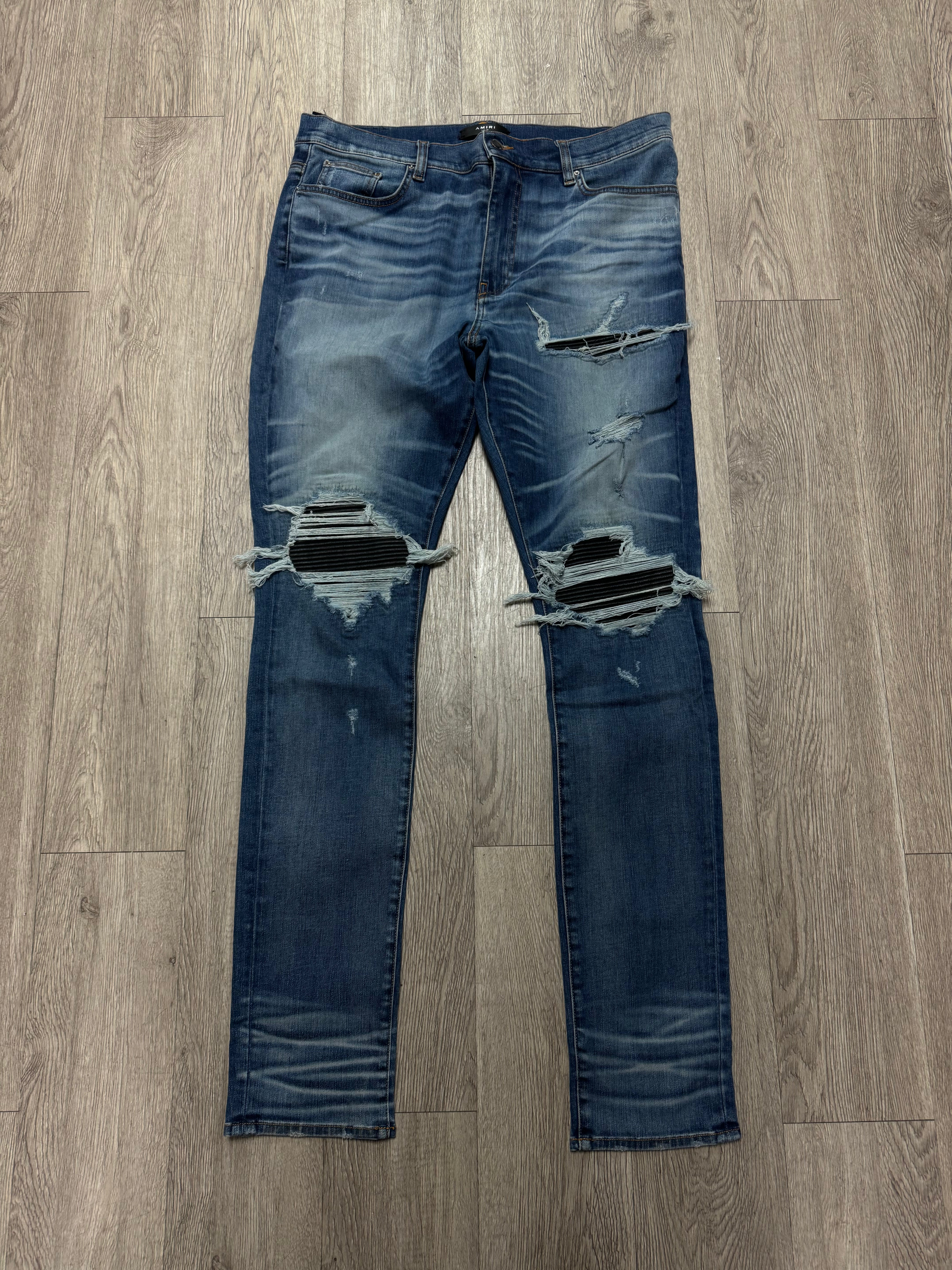 Amiri Light Wash Black Patch MX1 Jeans