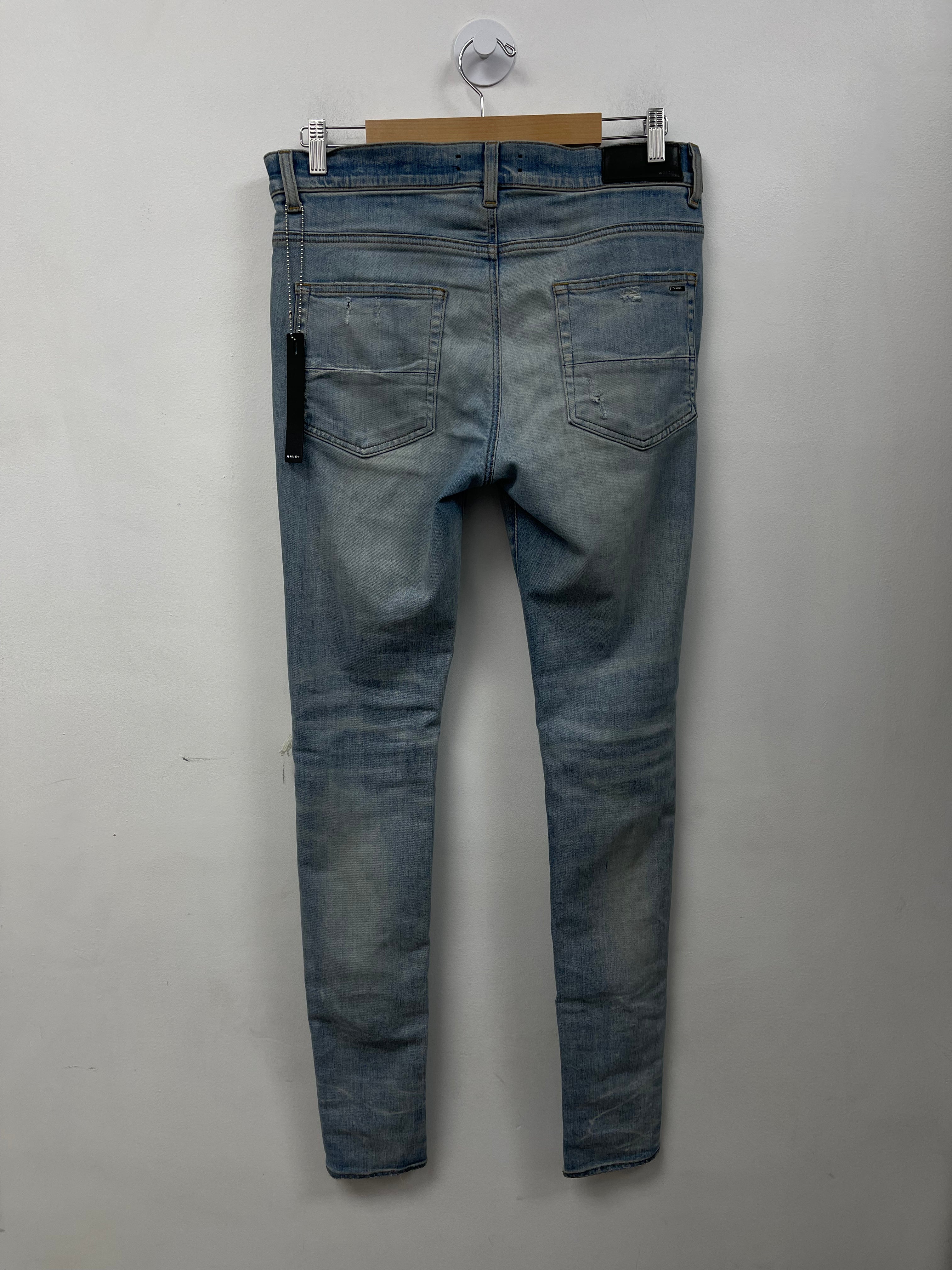 Amiri MX1 Light Wash White Jeans