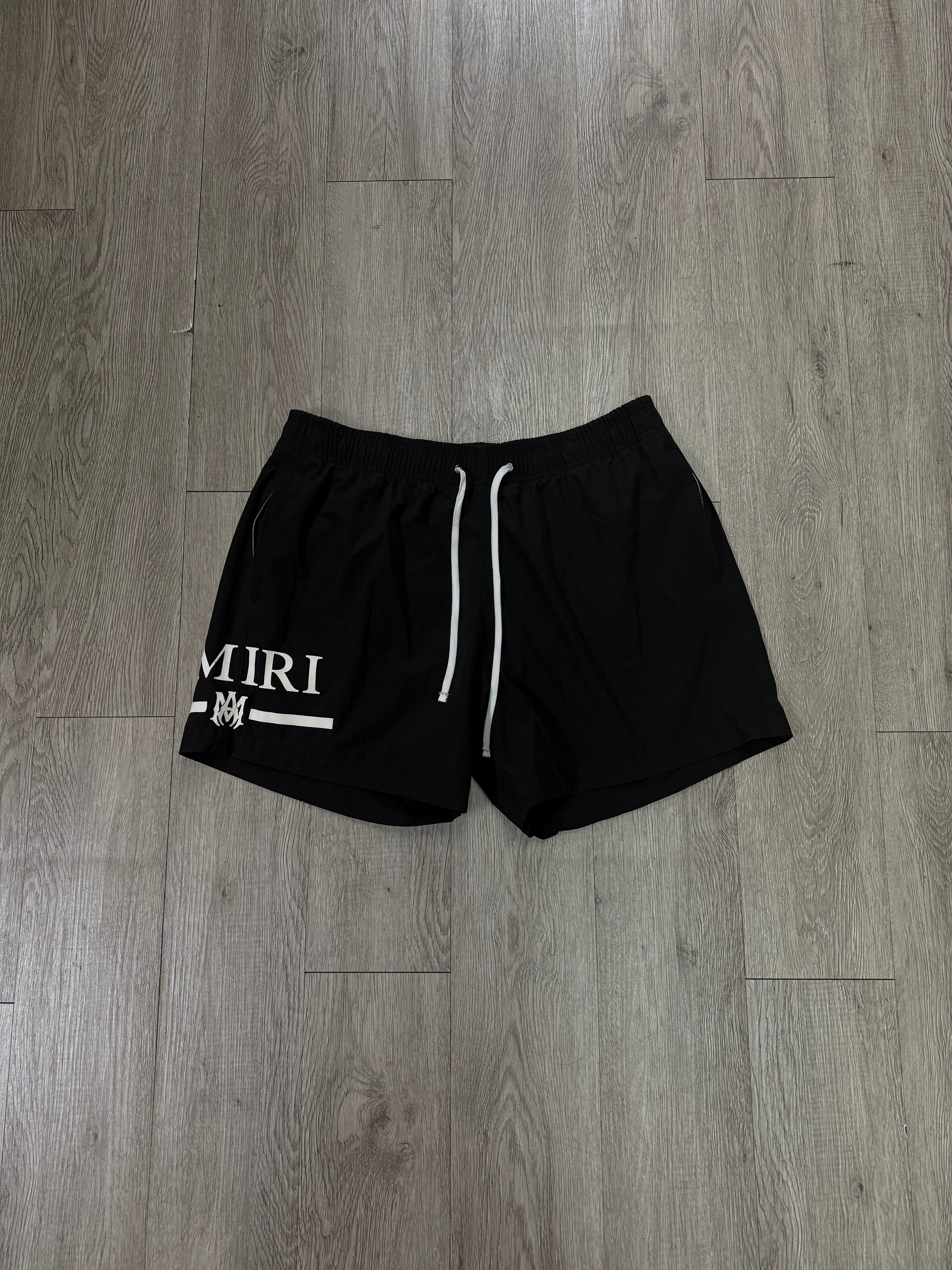 Amiri Black White MA Bar Logo Swim Trunks