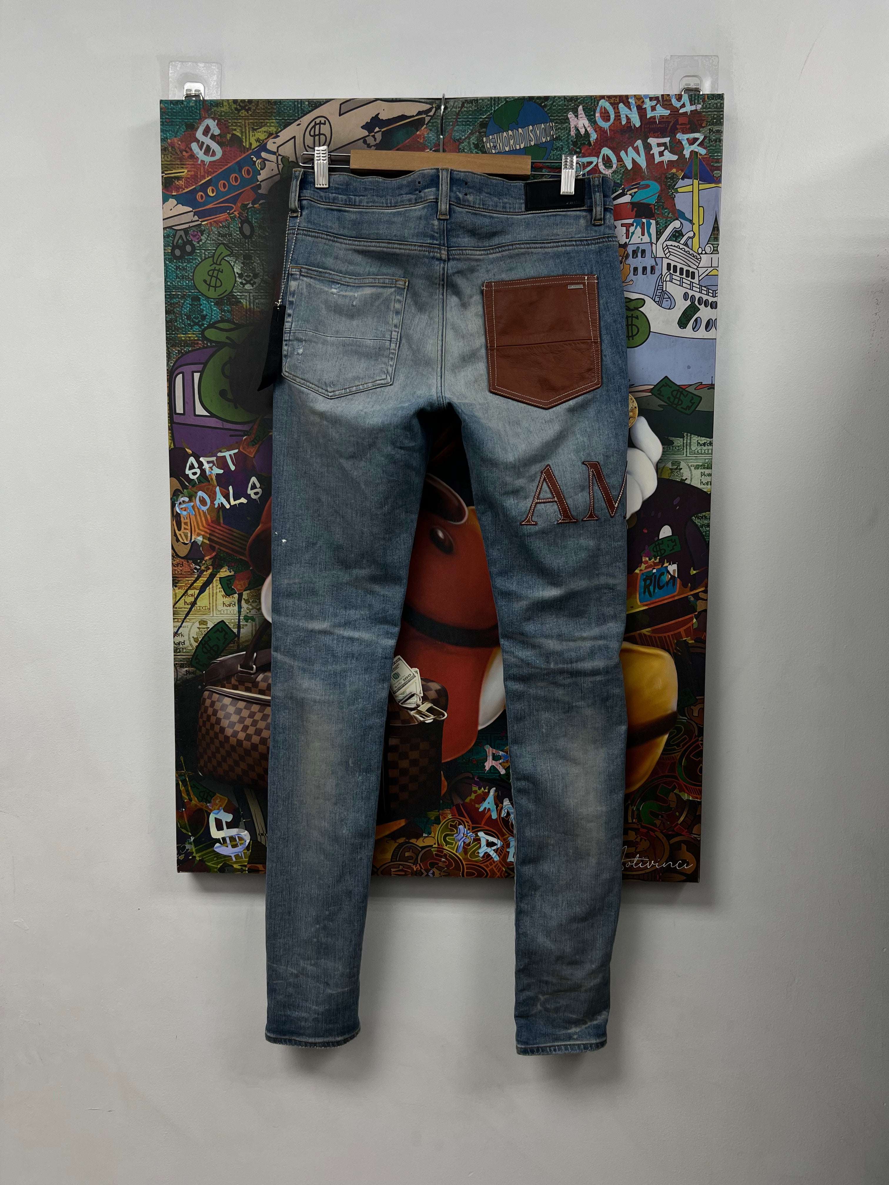 Amiri Light Wash Clay Side Logo Jeans