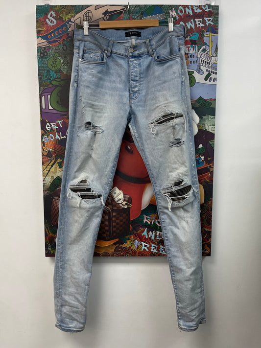 Amiri MX1 Light Wash Camo Patch Jeans