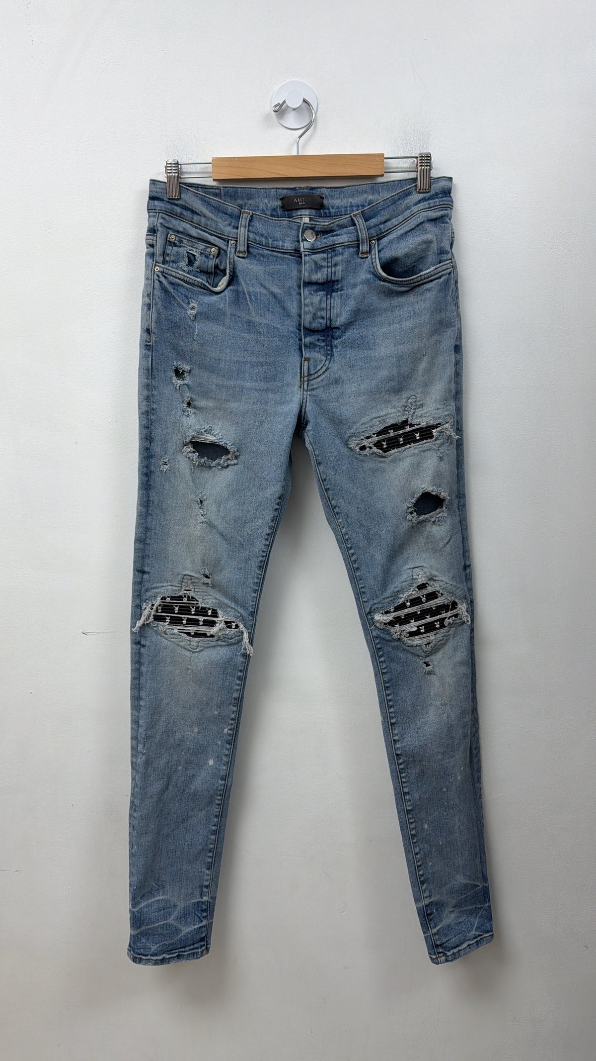 Amiri MX1 Light Wash Playboy Patch Jeans