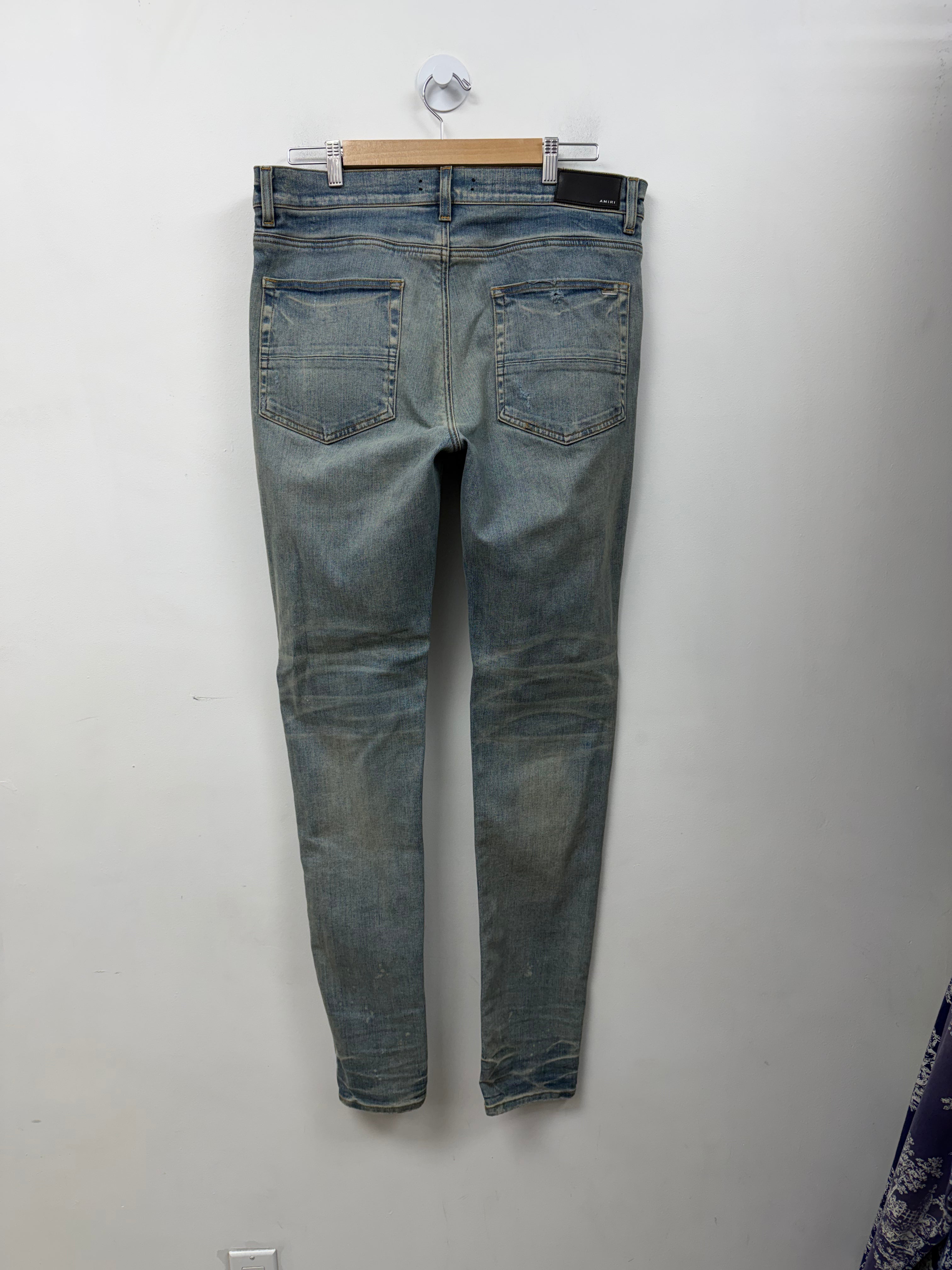 Amiri MX1 Light Wash Playboy Patch Jeans