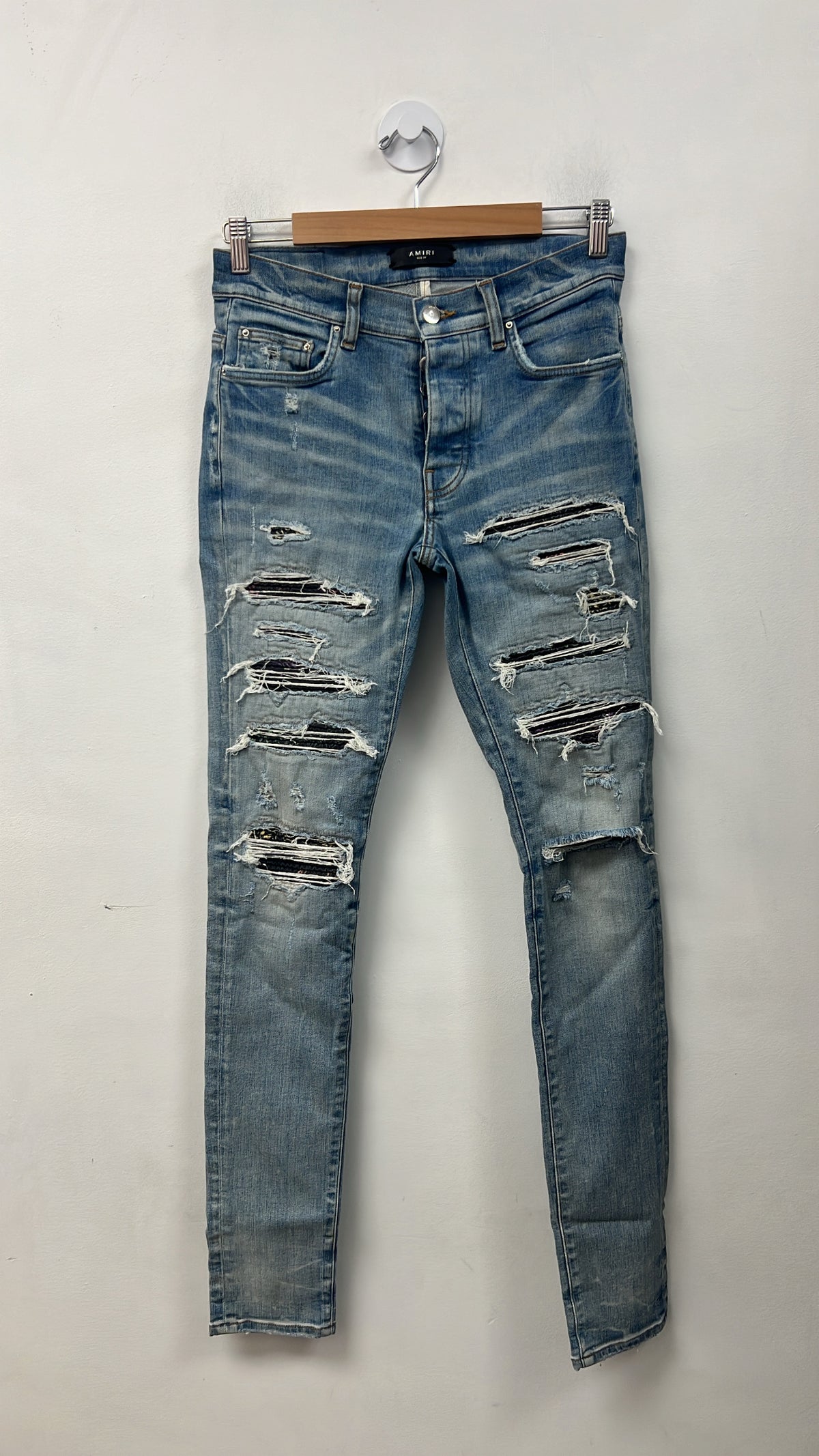 Amiri Light Wash Rainbow Thrasher Patch Jeans