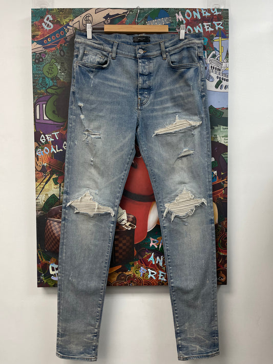 Amiri MX1 Light Wash White Patch Jeans