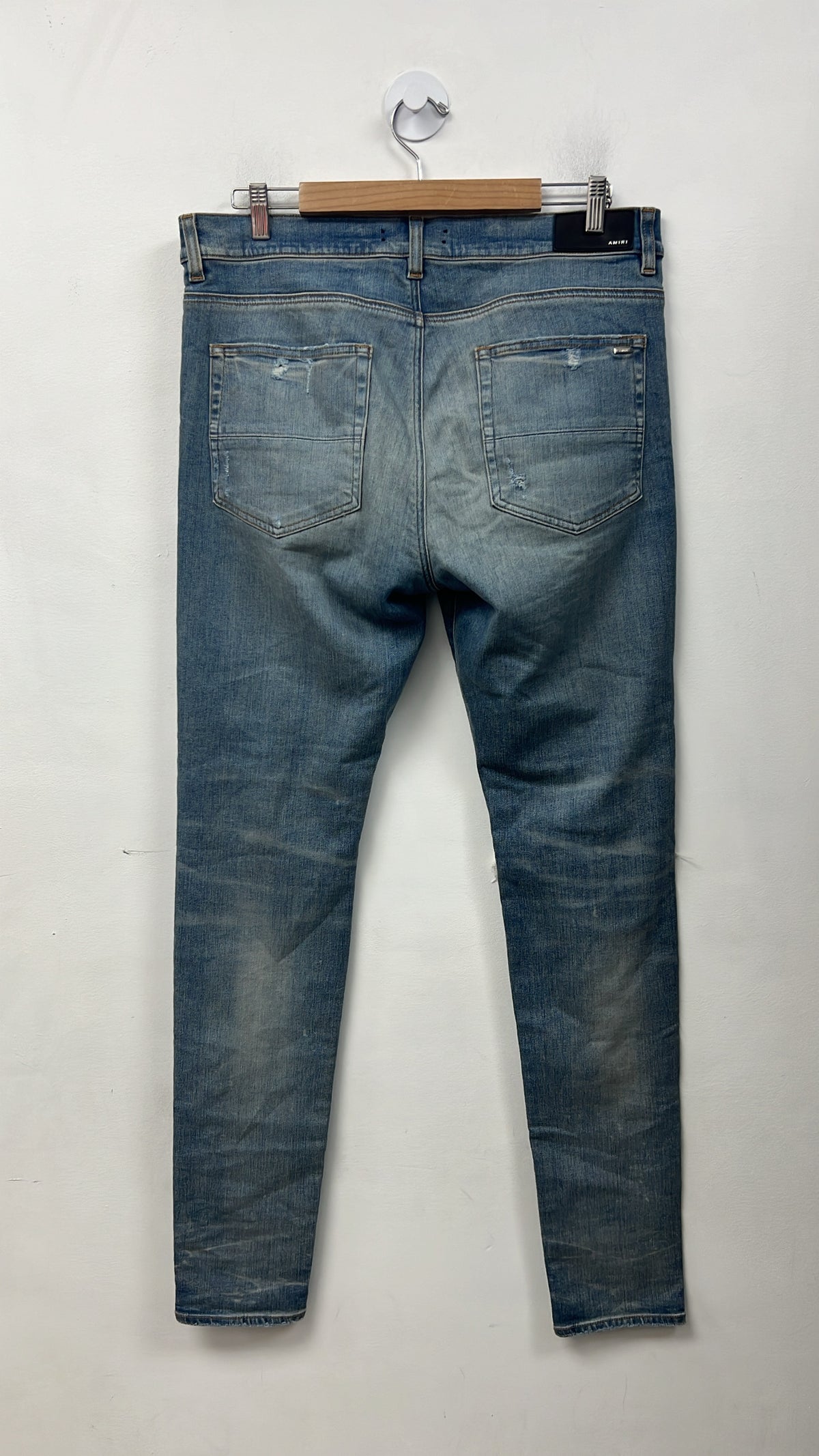 Amiri Light Wash Blue Tie Dye Thrasher Patch Jeans