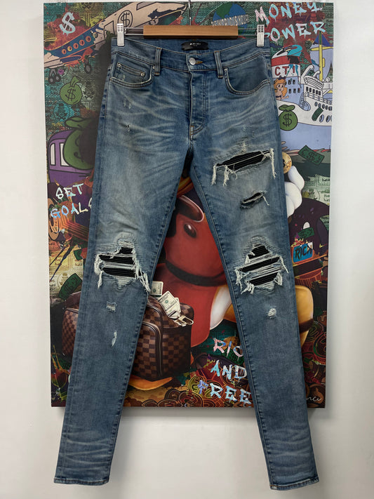 Amiri MX1 Light Wash Black Patch Jeans
