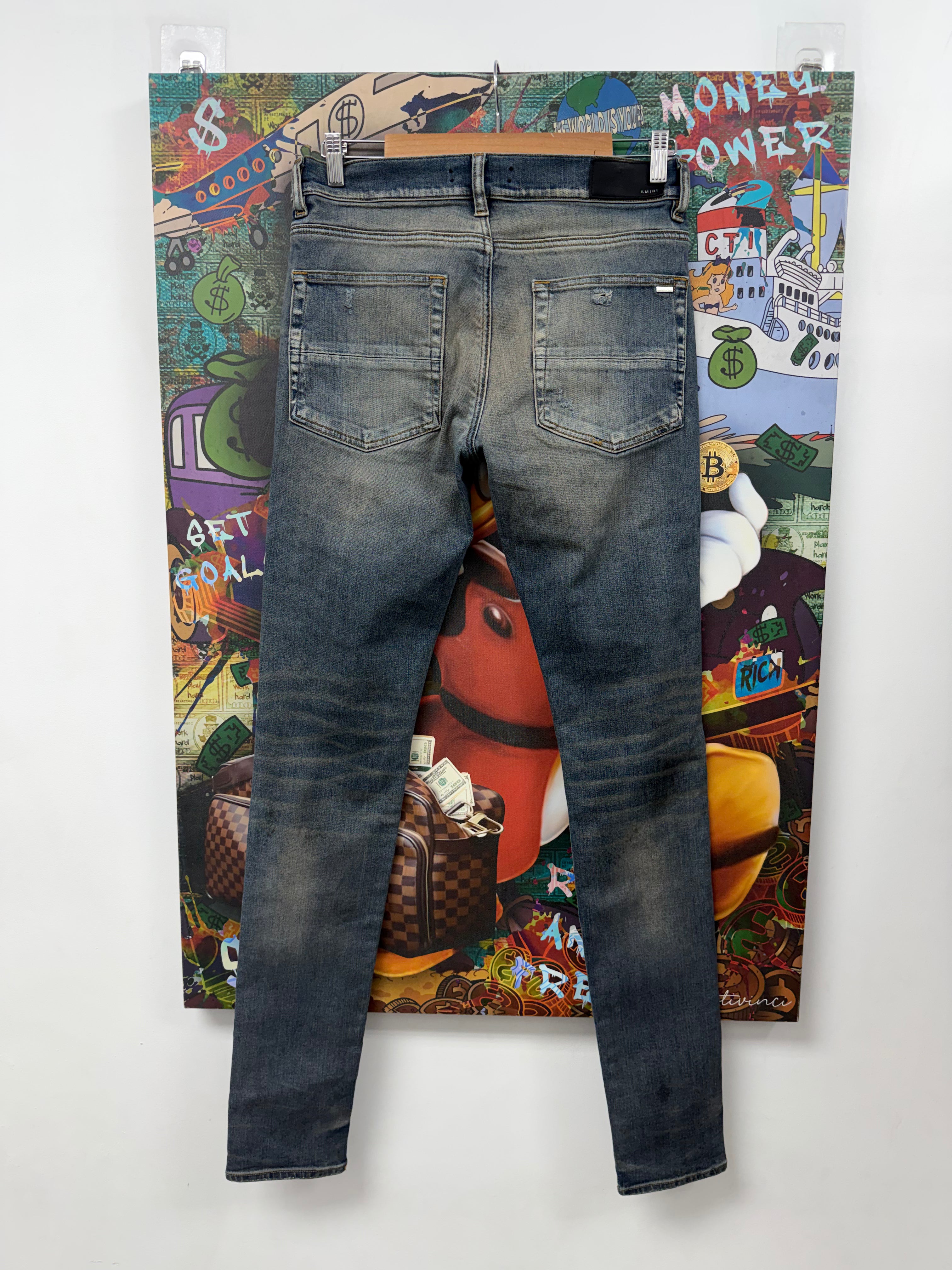 Amiri MX1 Rust Black Thrasher Patch Jeans