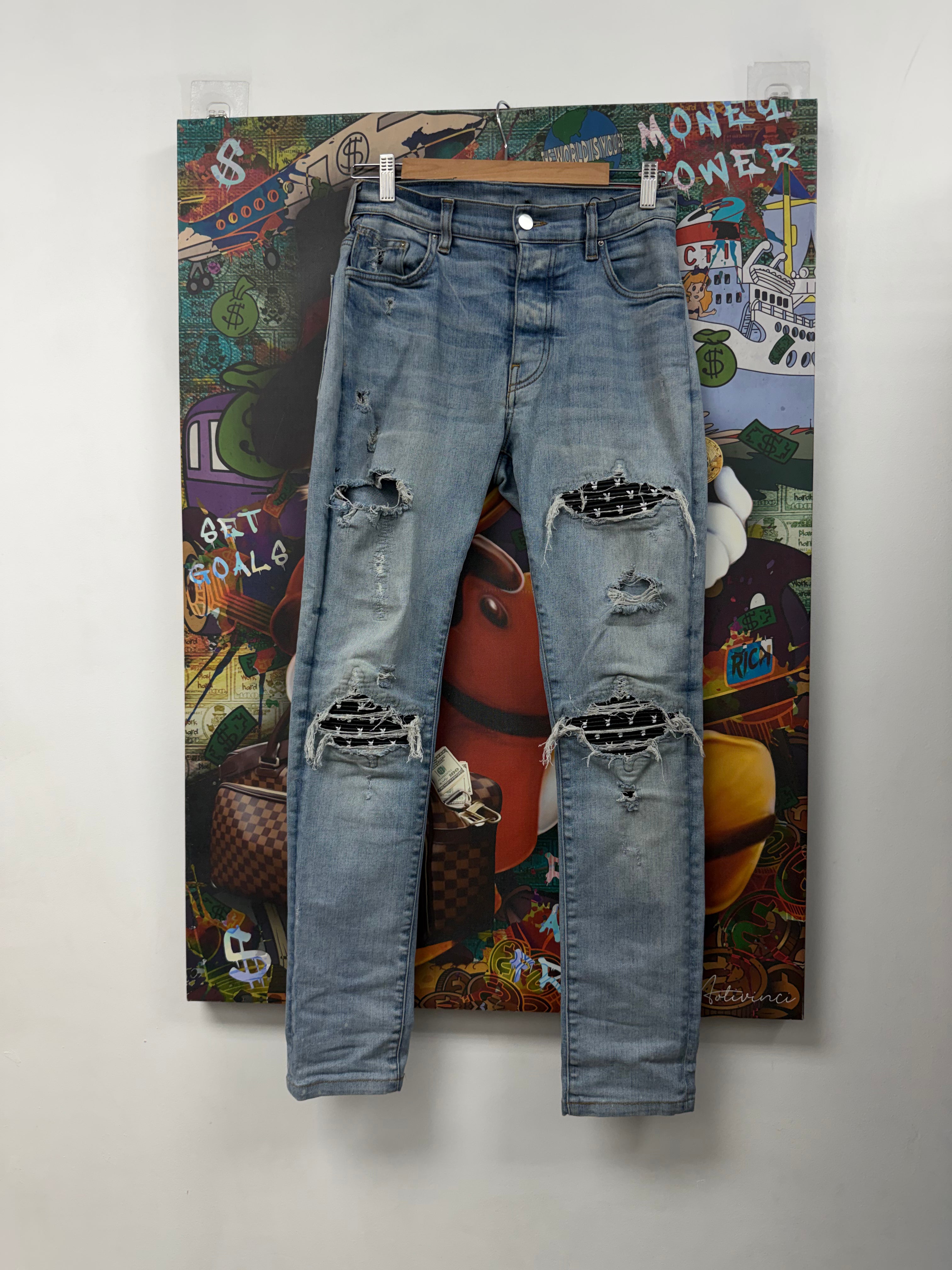 Amiri MX1 Light Wash Black Playboy Patch Jeans