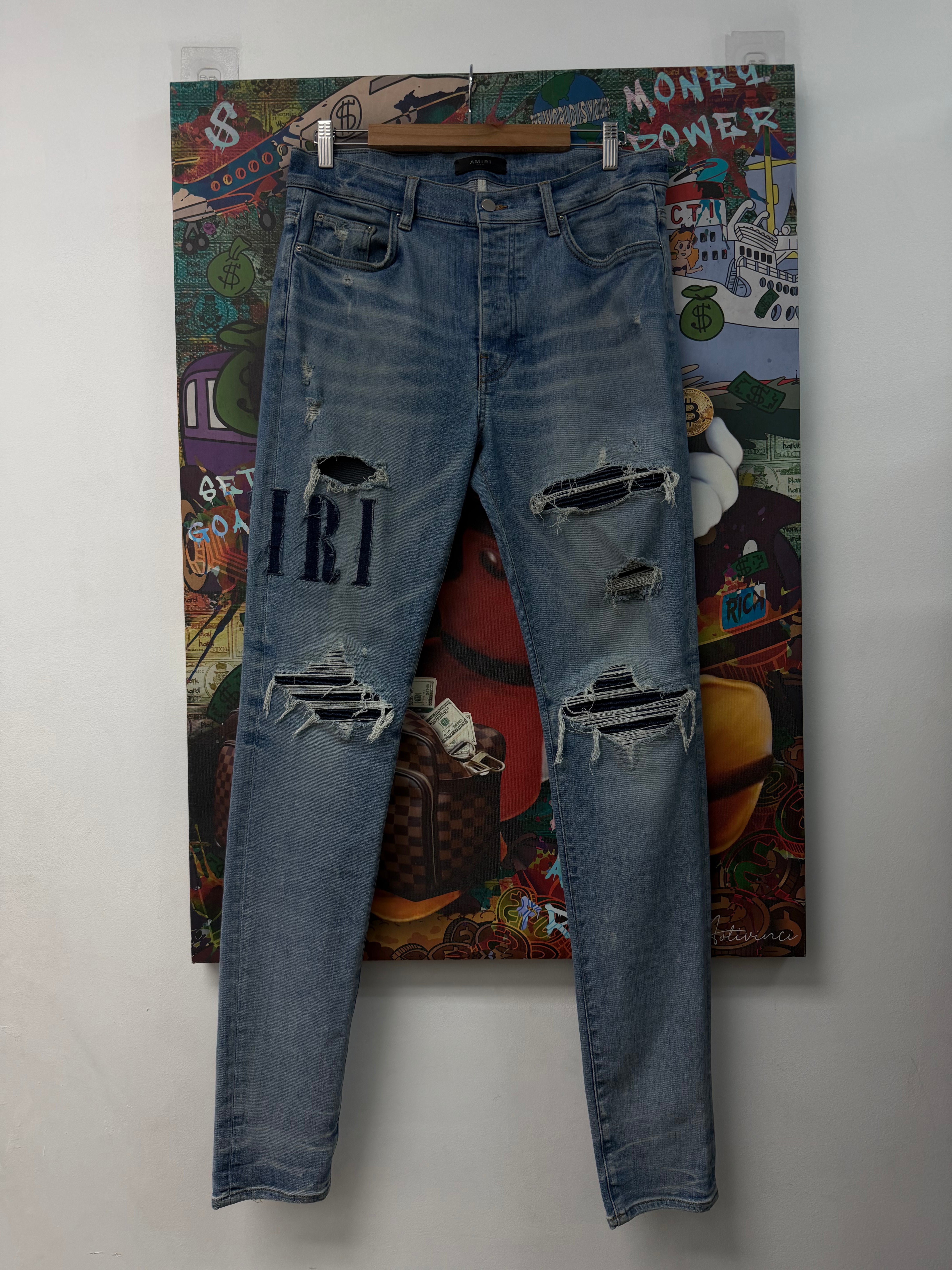 Amiri MX1 Light Wash Denim Applique Jeans