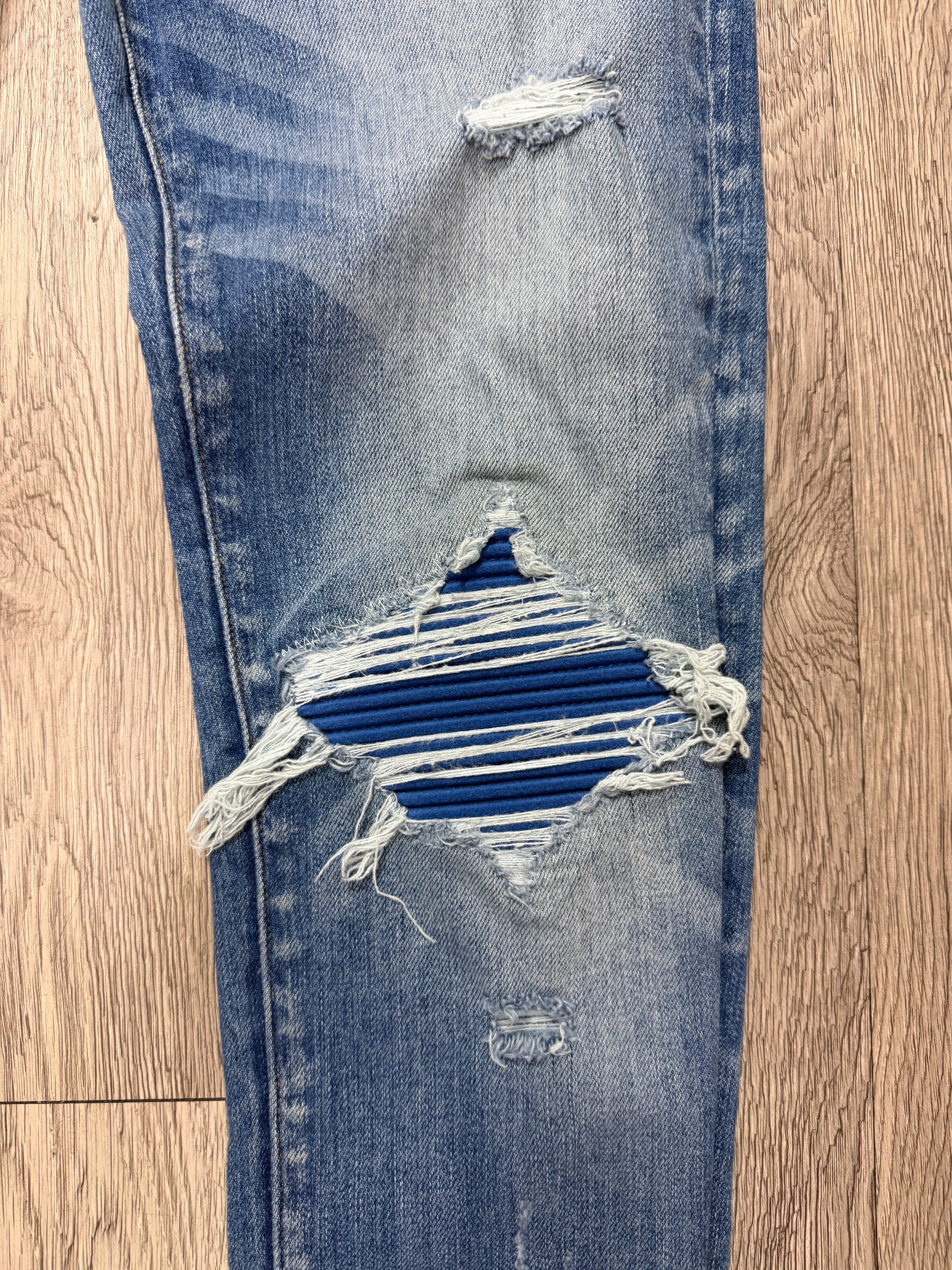 Amiri MX1 Light Wash Blue Patch Jeans