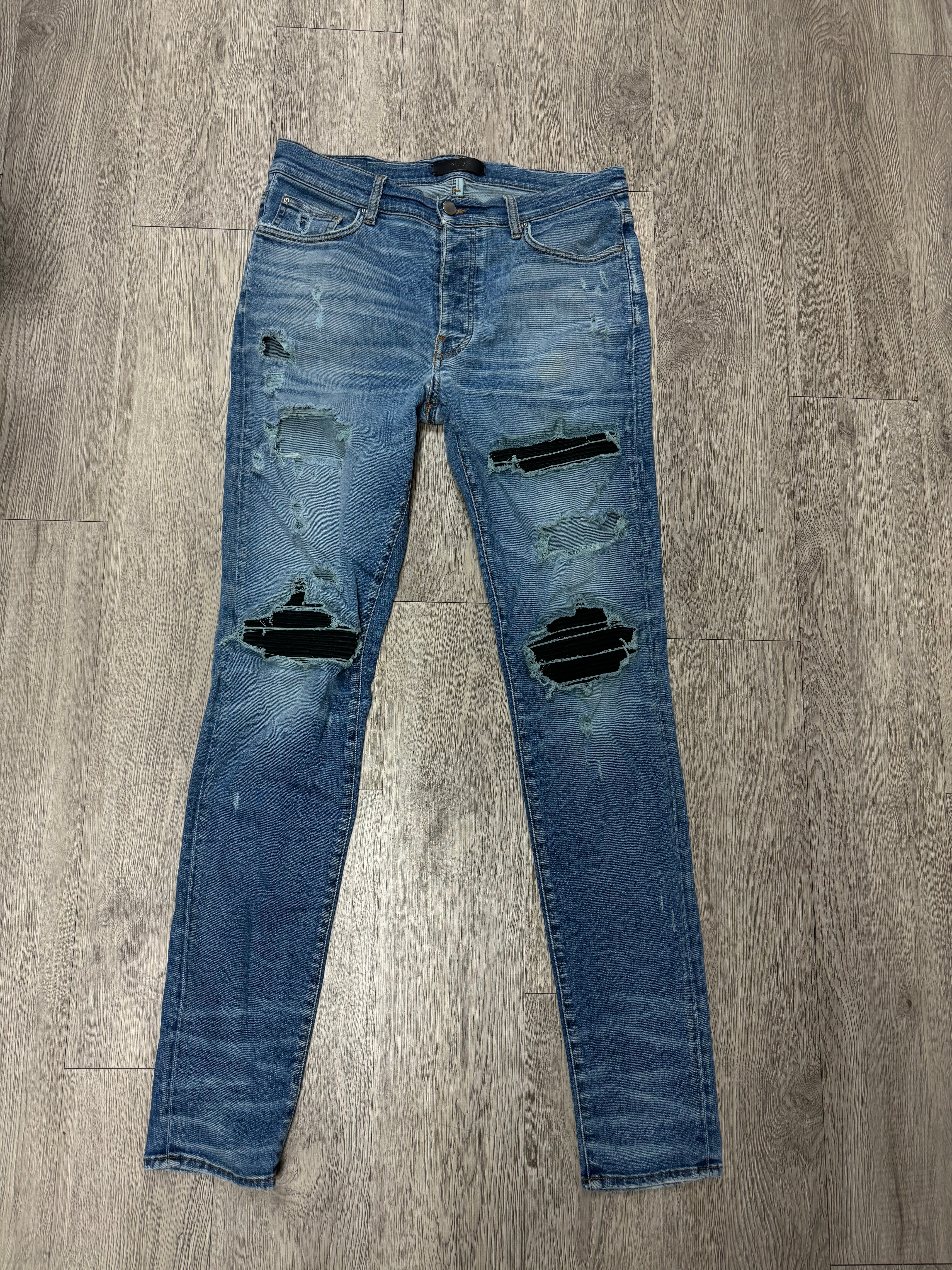 Amiri Light Wash Black Patch MX1 Jeans