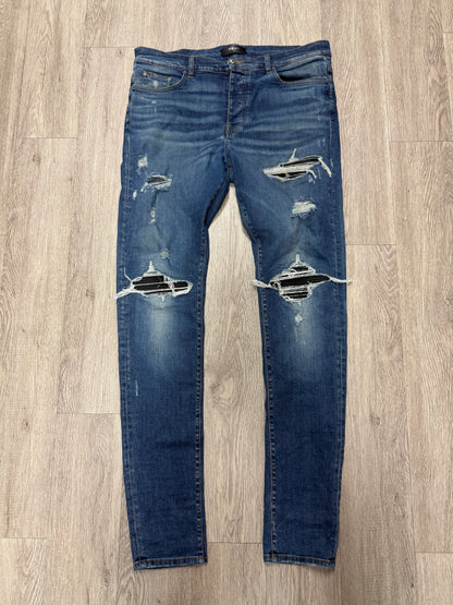 Amiri MX1 Light Wash Black Patch Jeans