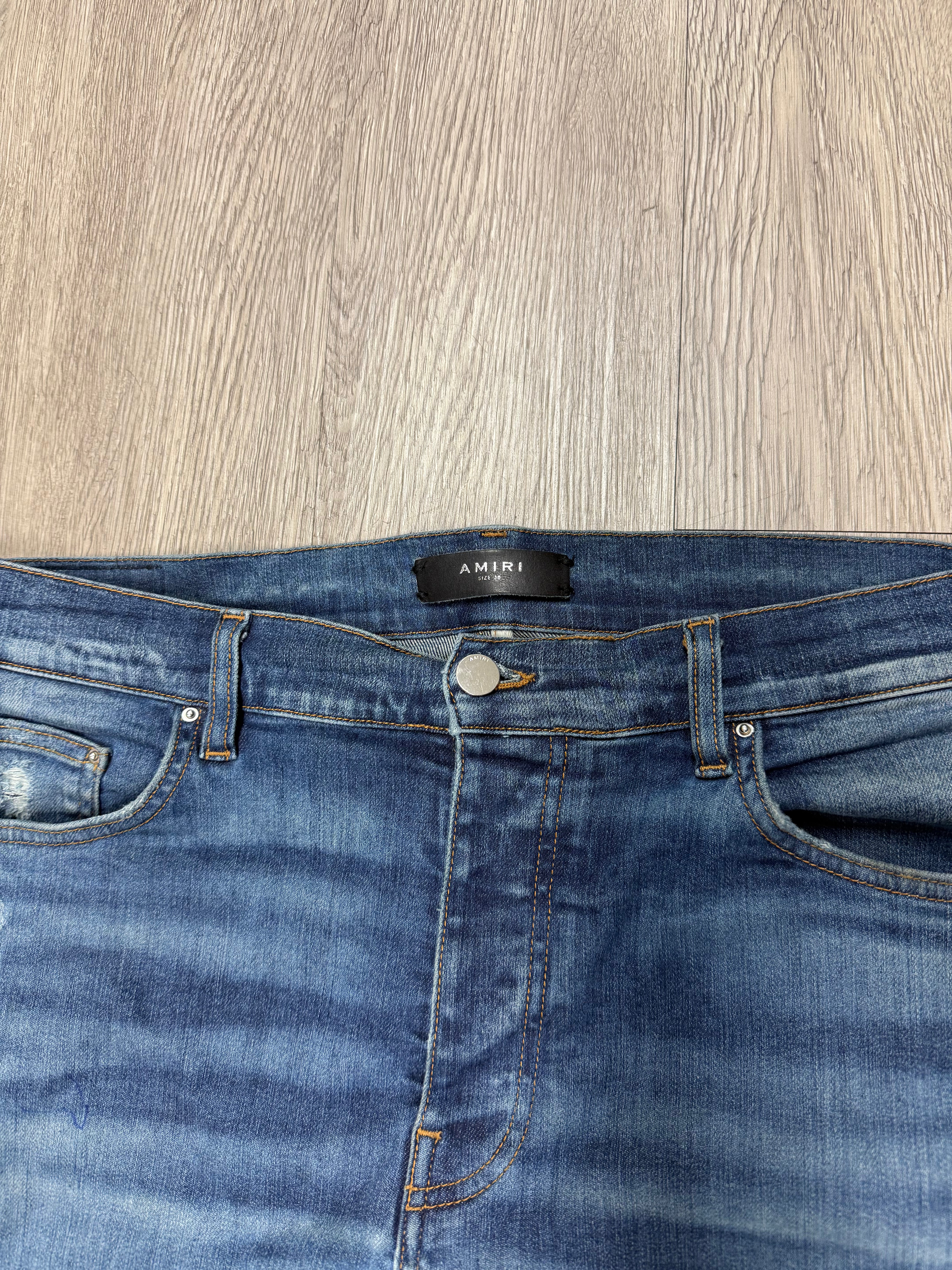 Amiri MX1 Light Wash Black Patch Jeans