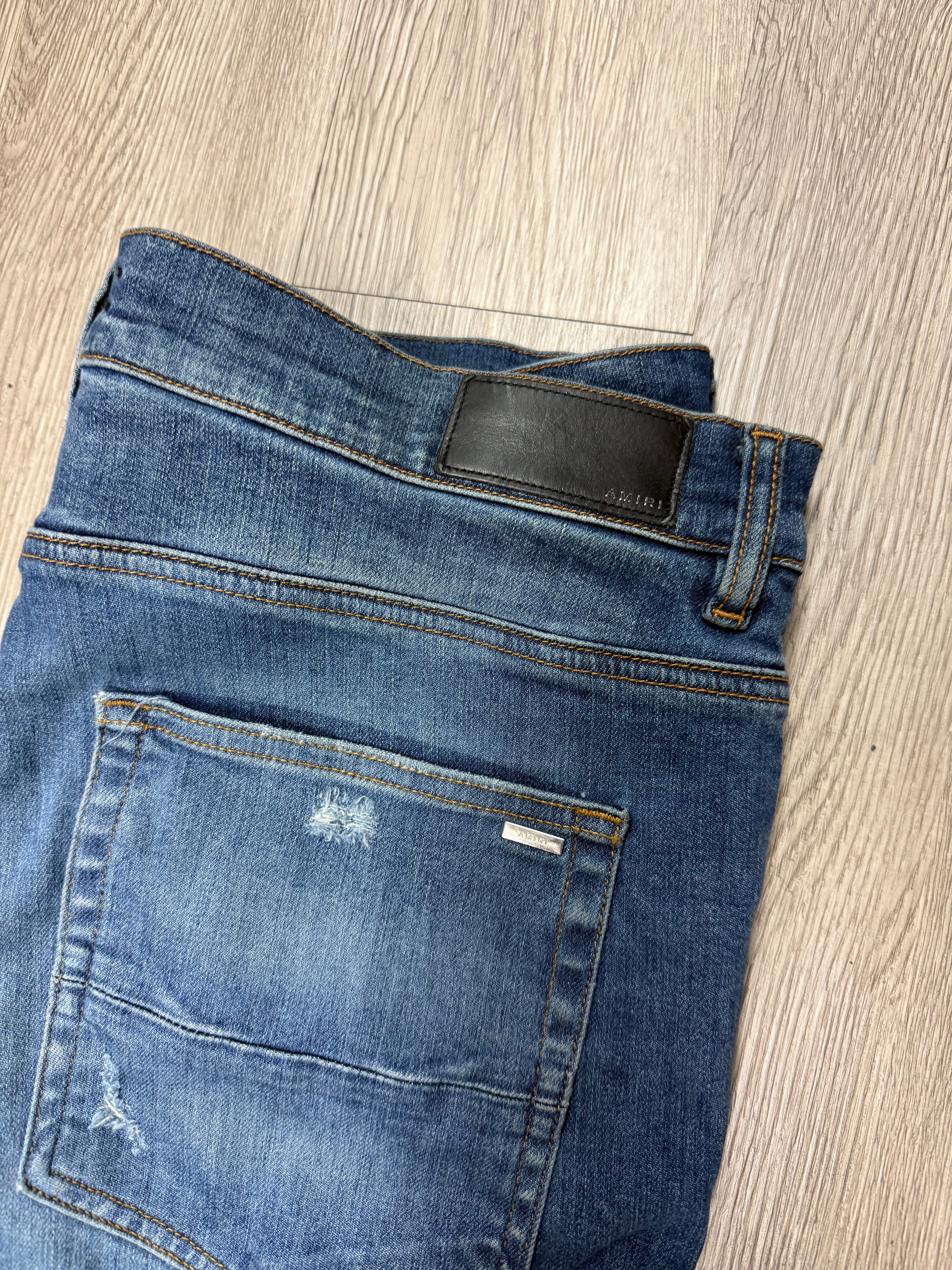 Amiri MX1 Light Wash Black Patch Jeans