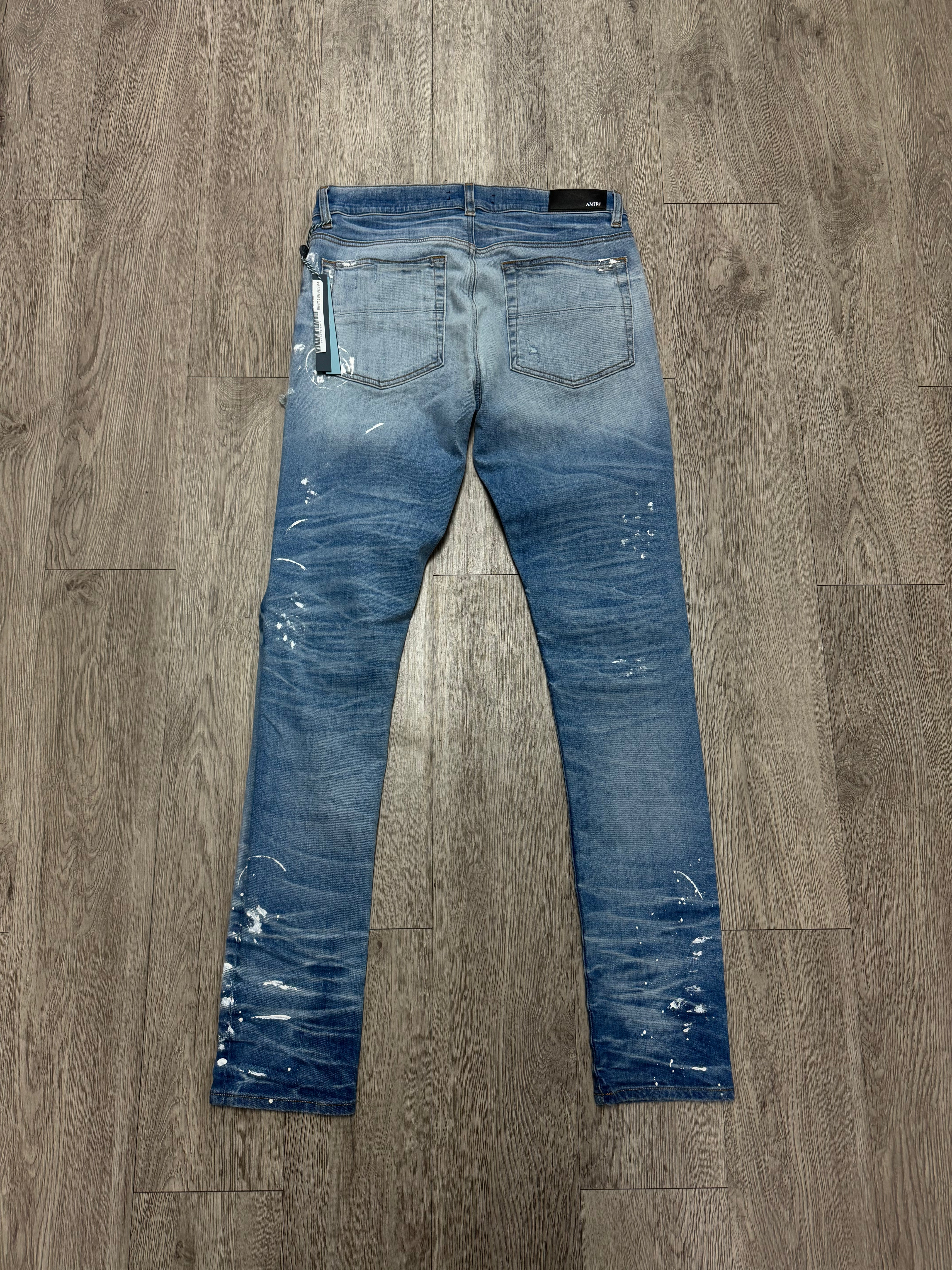 Amiri Light Wash White Splatter Denim Patch MX1 Jeans