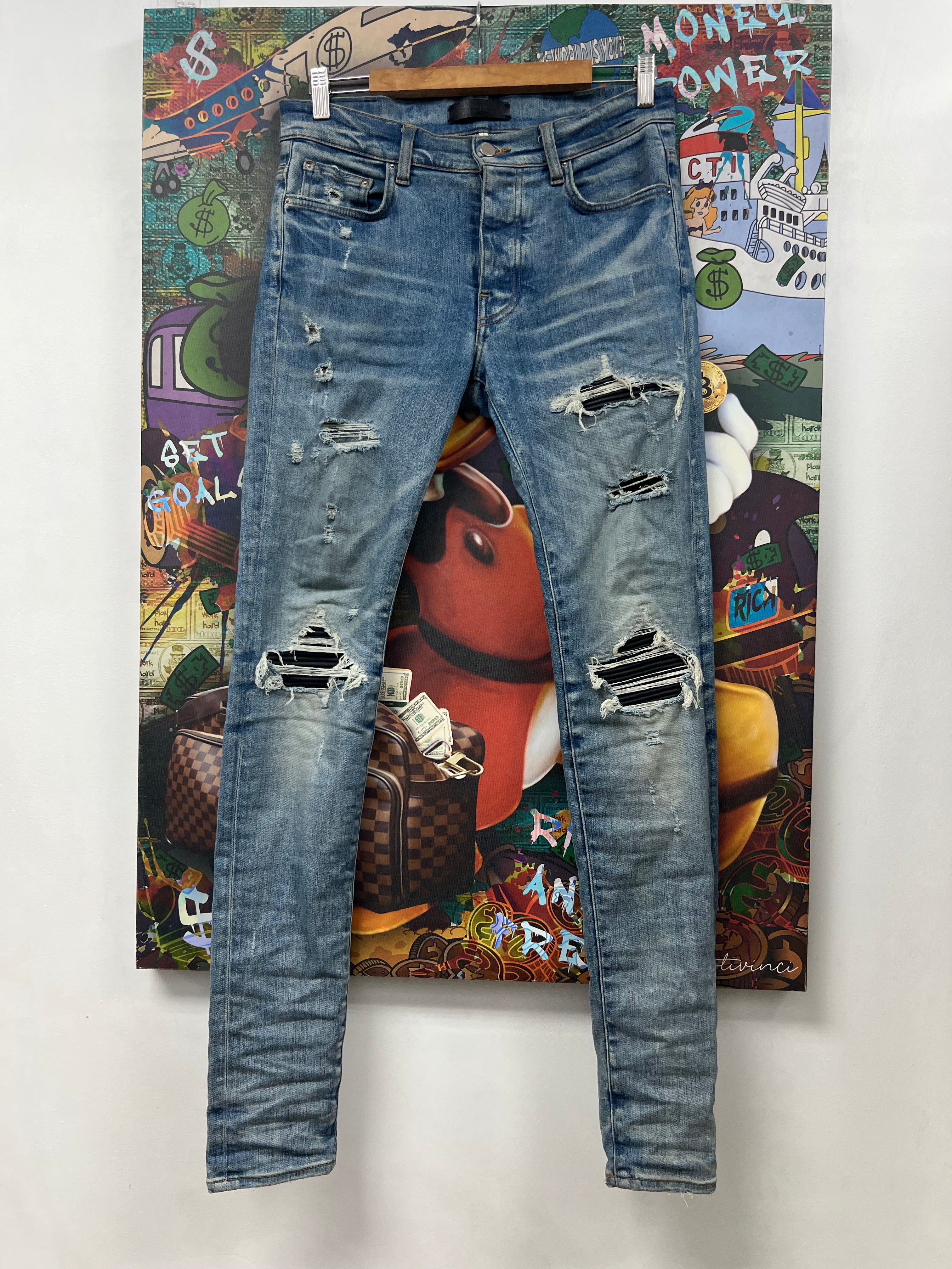 Amiri MX1 Light Wash Black Patch Jeans