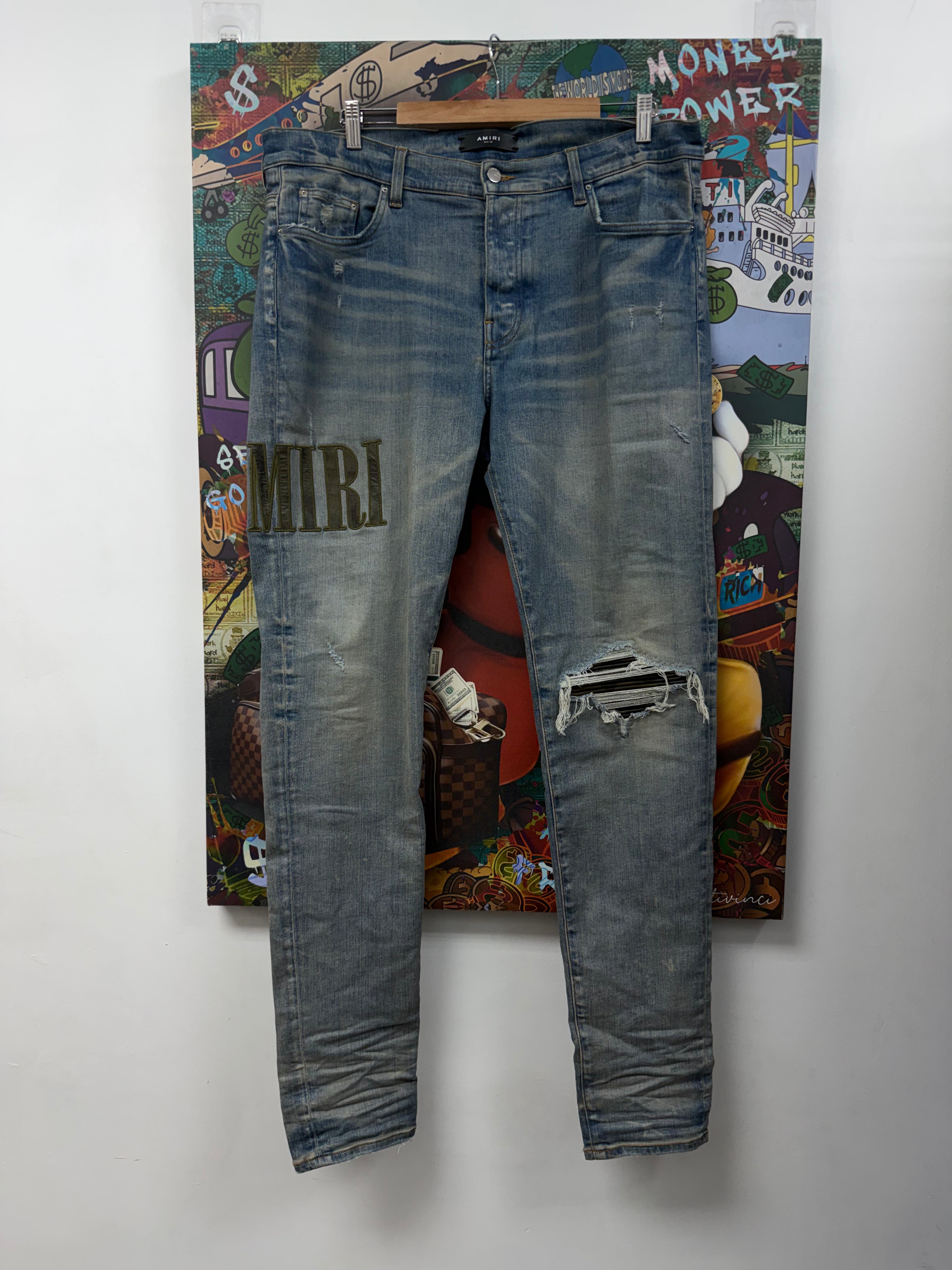 Amiri MX1 Light Wash Camo Patch Jeans
