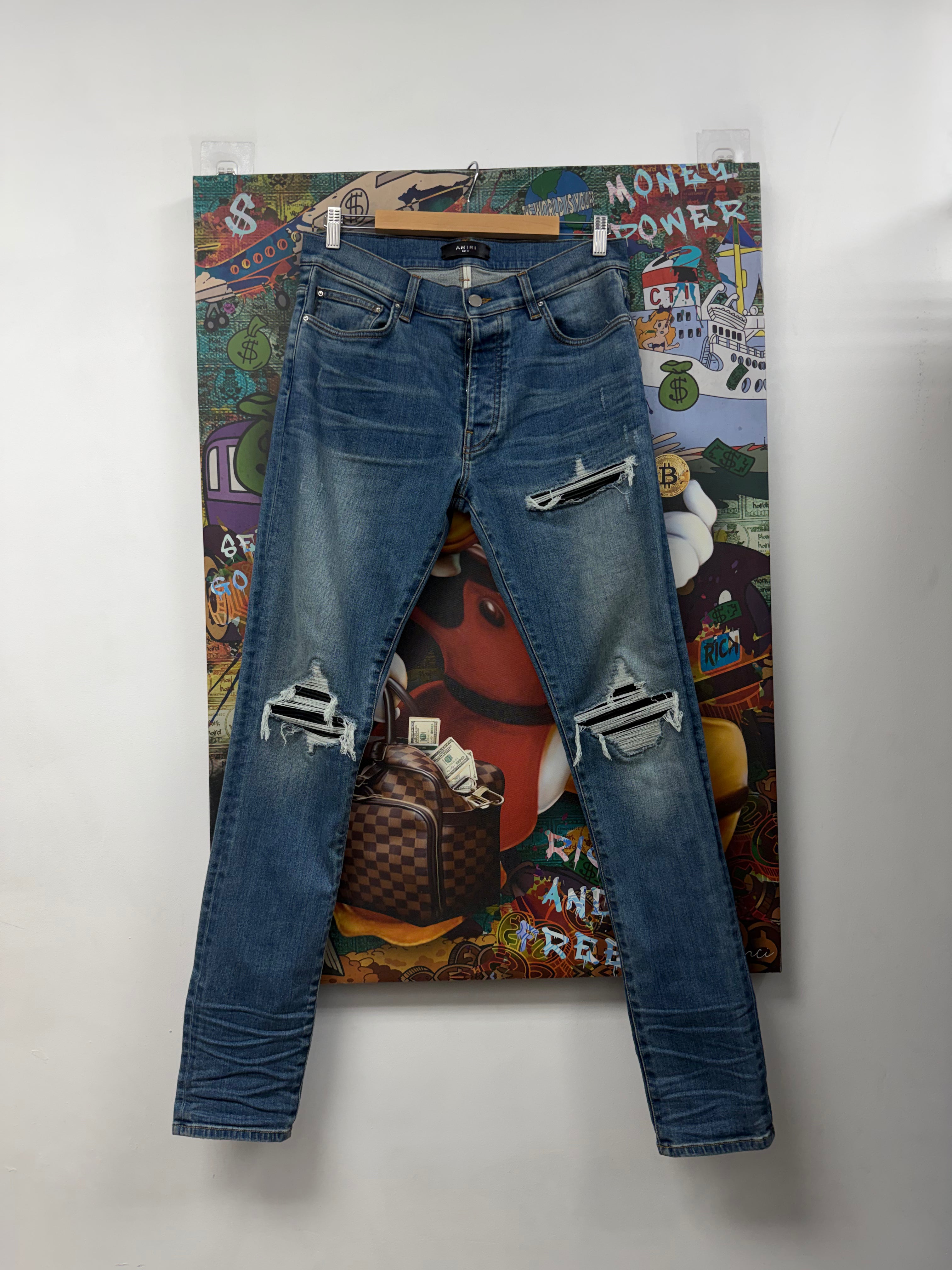 Amiri MX1 Light Wash Black Patch Jeans