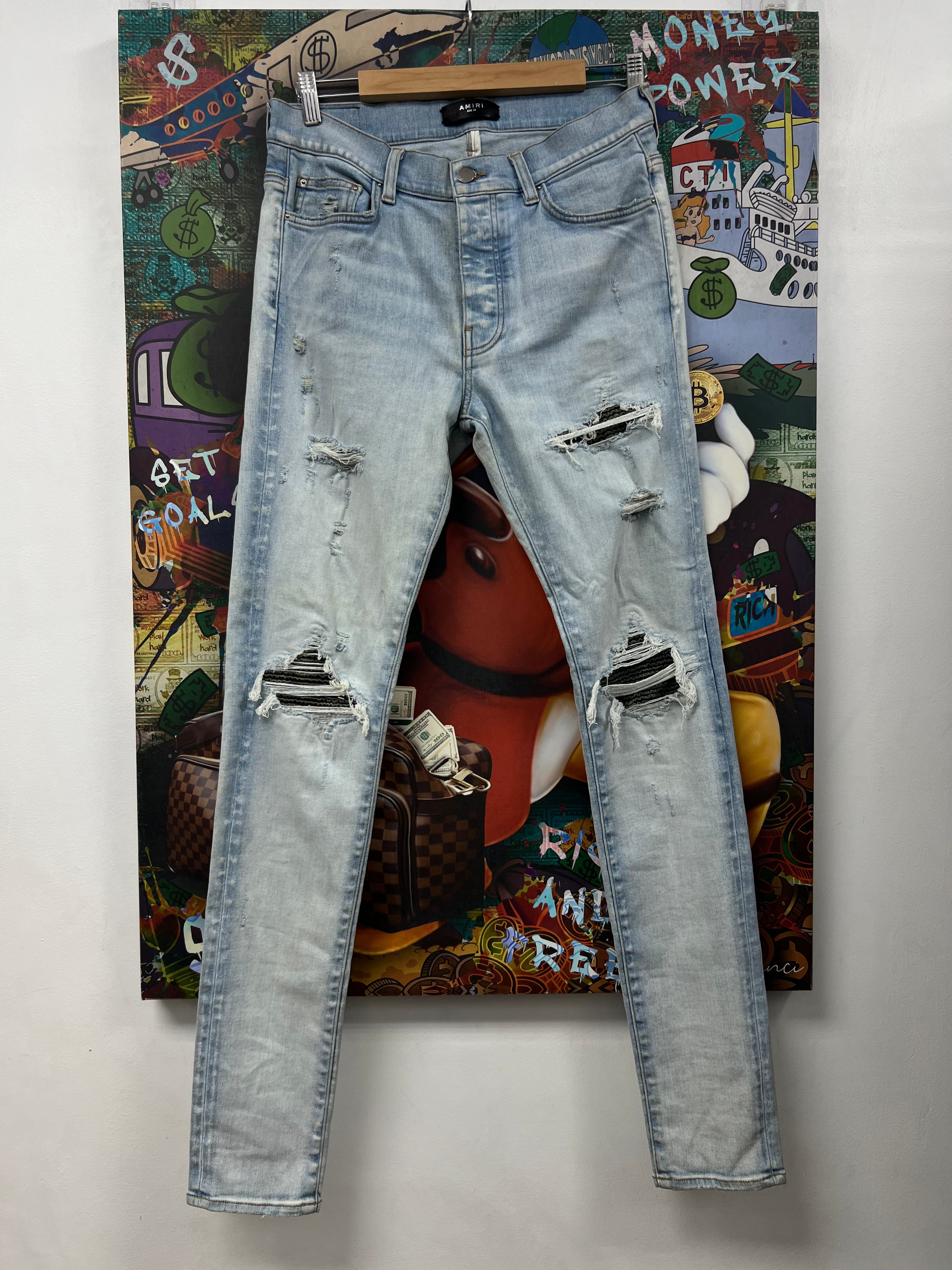Amiri MX1 Light Wash Camo Patch Jeans