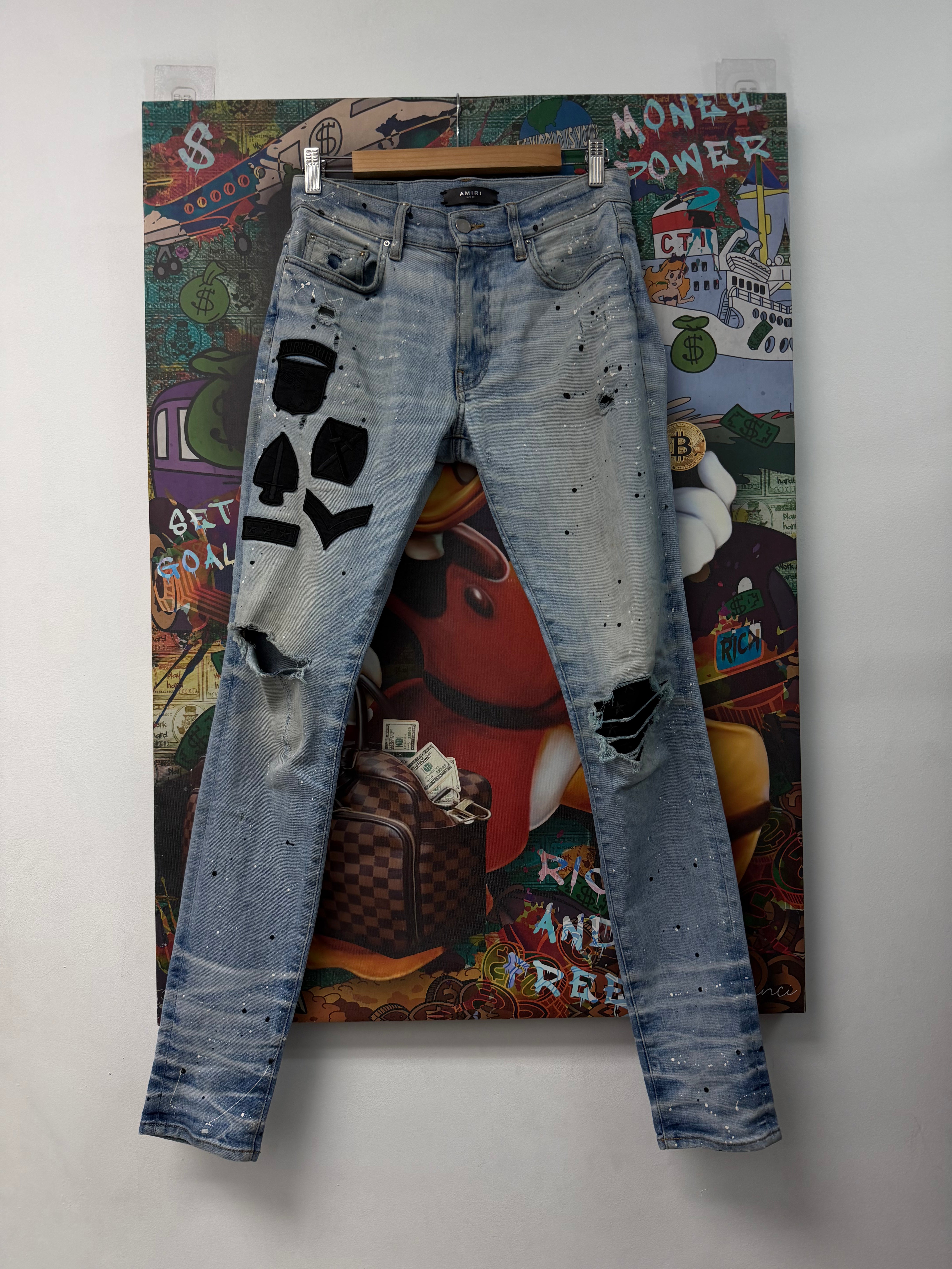 Amiri Light Wash Black Biker Patch Jeans