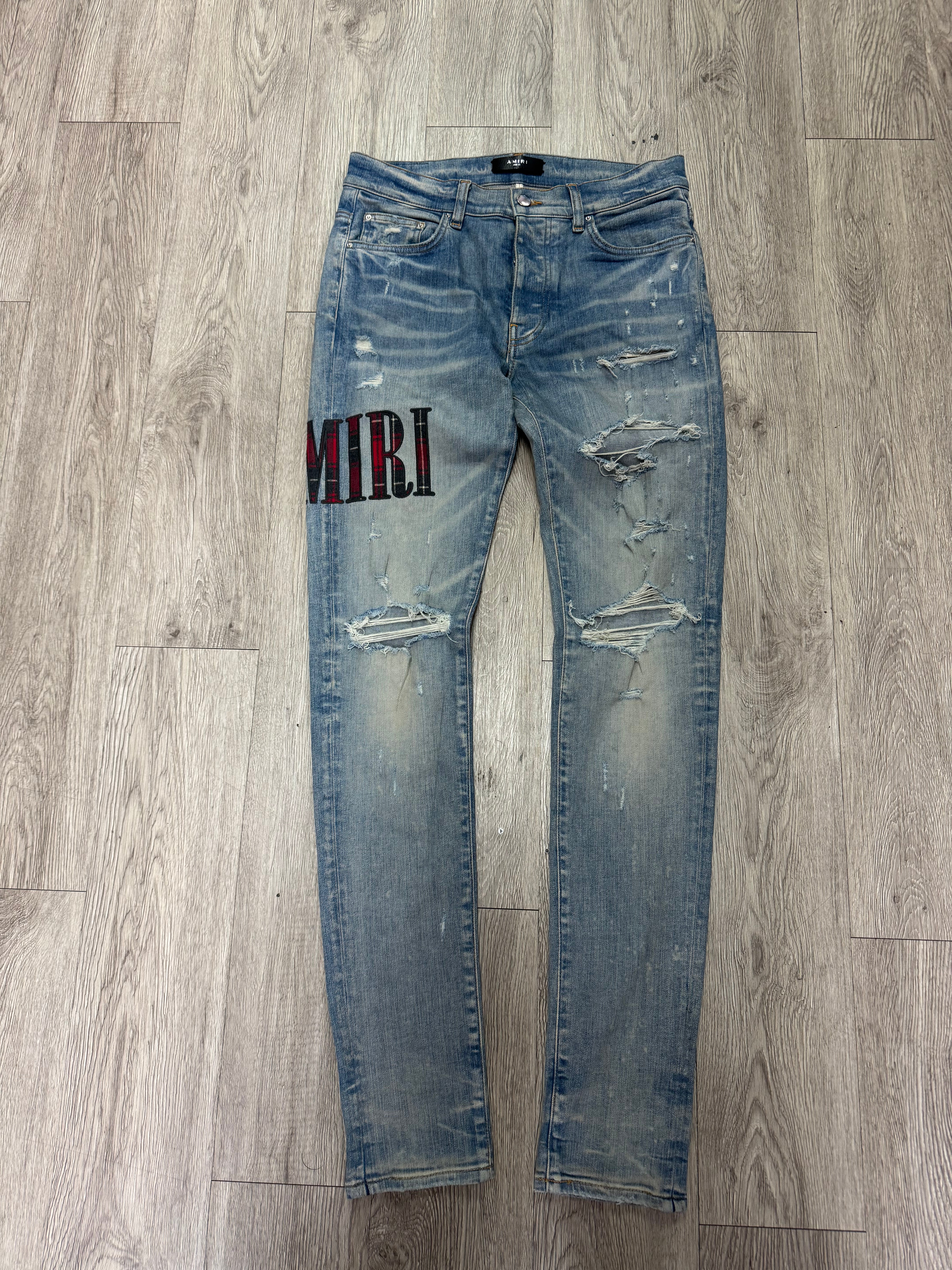 Amiri Light Wash Plaid Side Logo Jeans