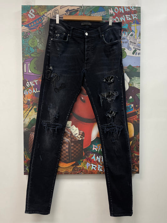 Amiri Old English Black Patch Jeans