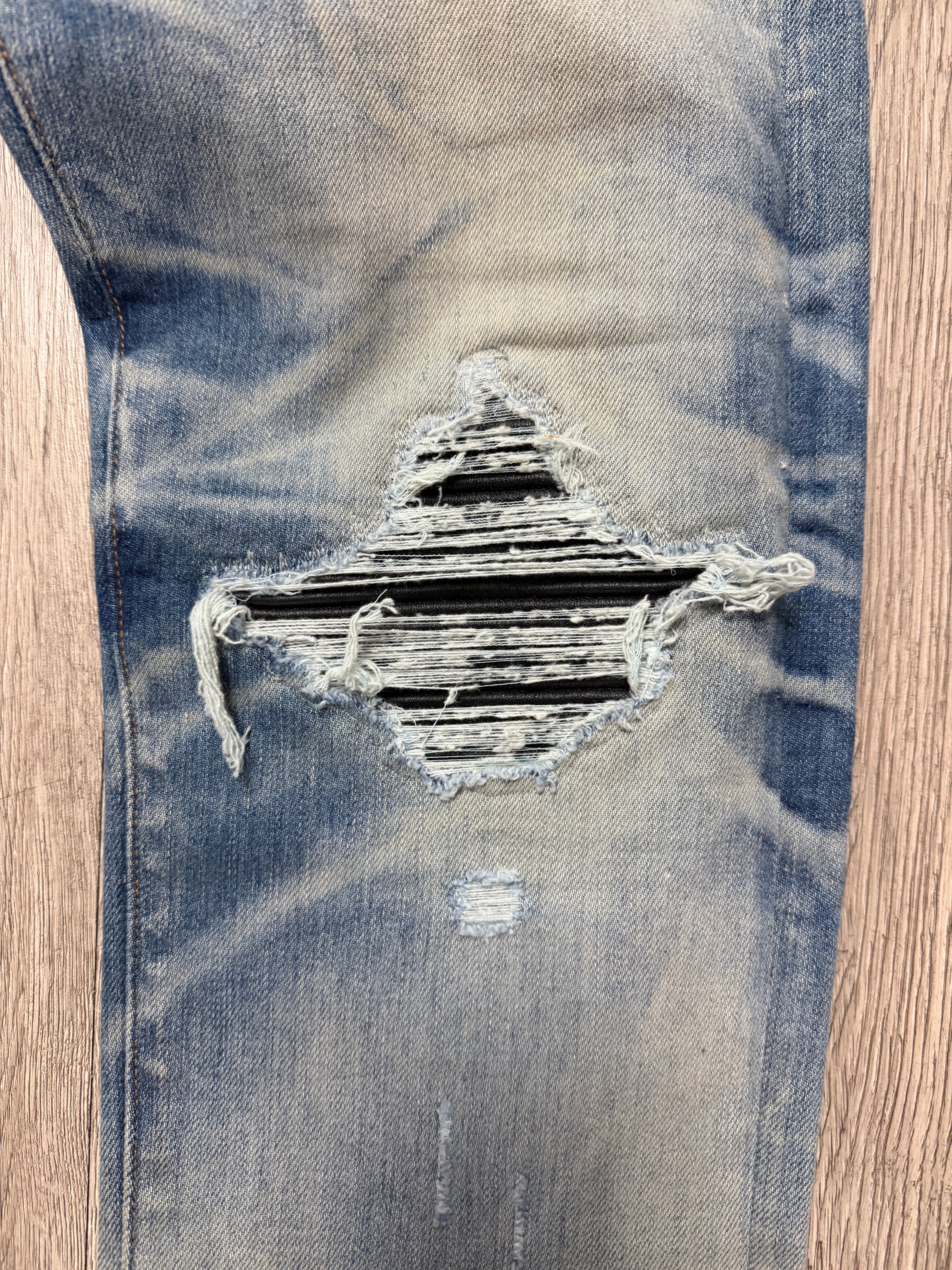 Amiri MX1 Light Wash Black Patch Jeans