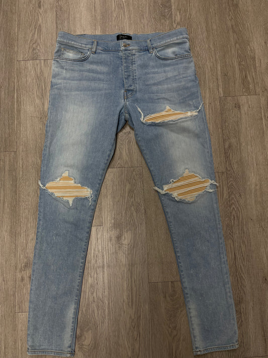 Amiri MX1 Light Wash Yellow Dust Patch Jeans
