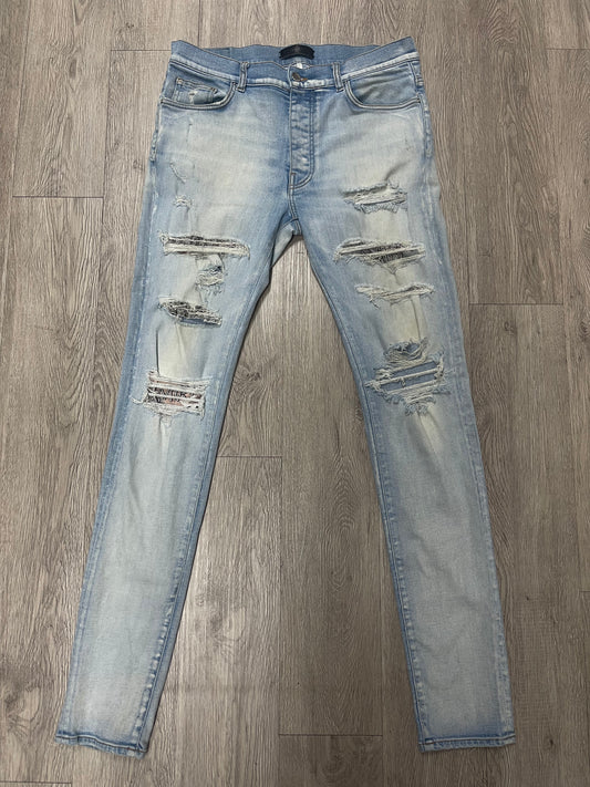 Amiri Light Wash Hibuscus Patch Jeans