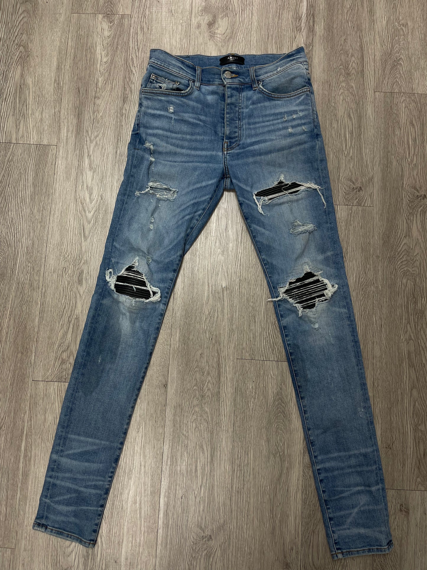 Amiri Light Wash Black Patch MX1 Jeans