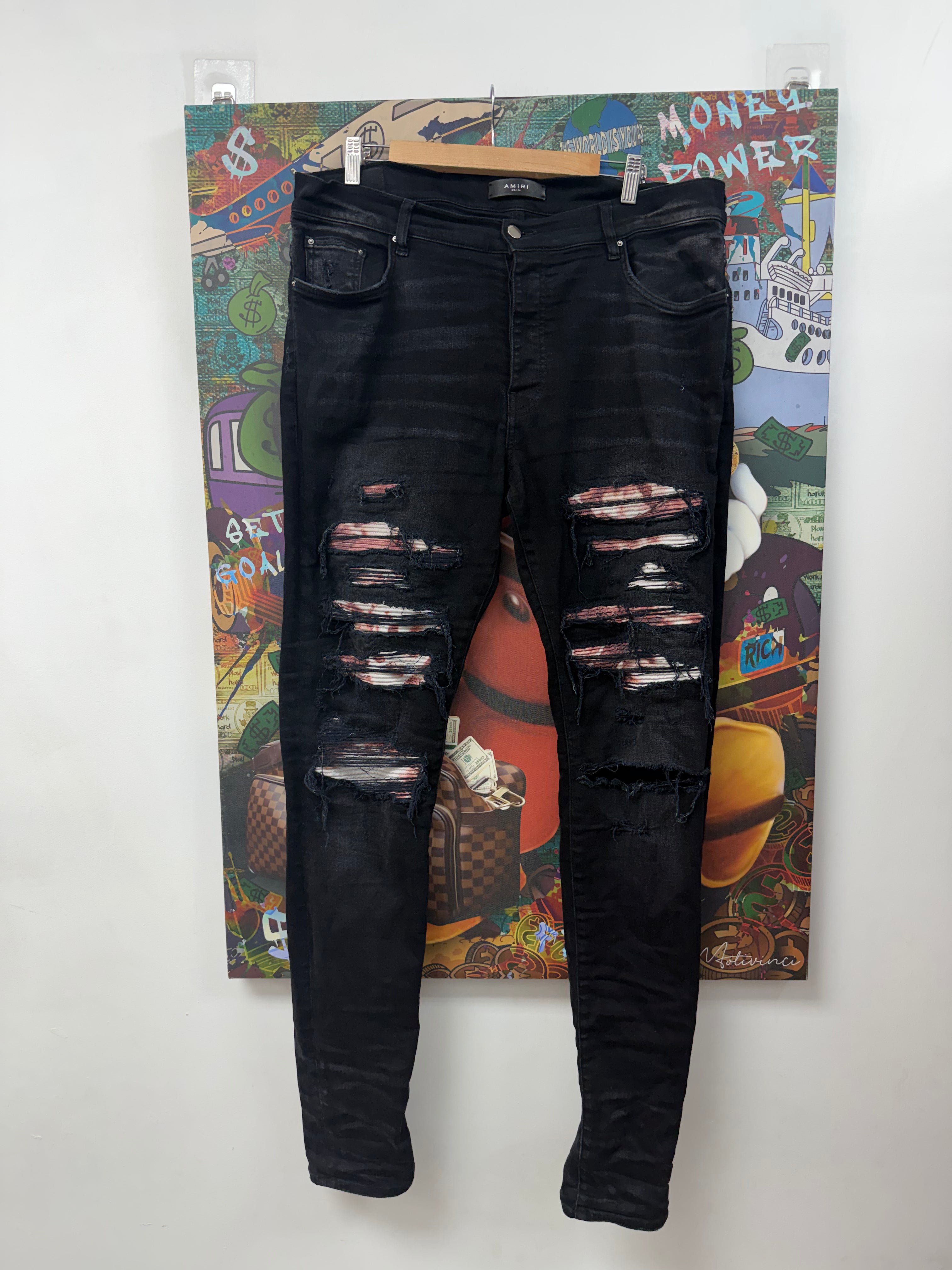 Amiri Black Wash Red Tie Dye Thrasher Patch Jeans