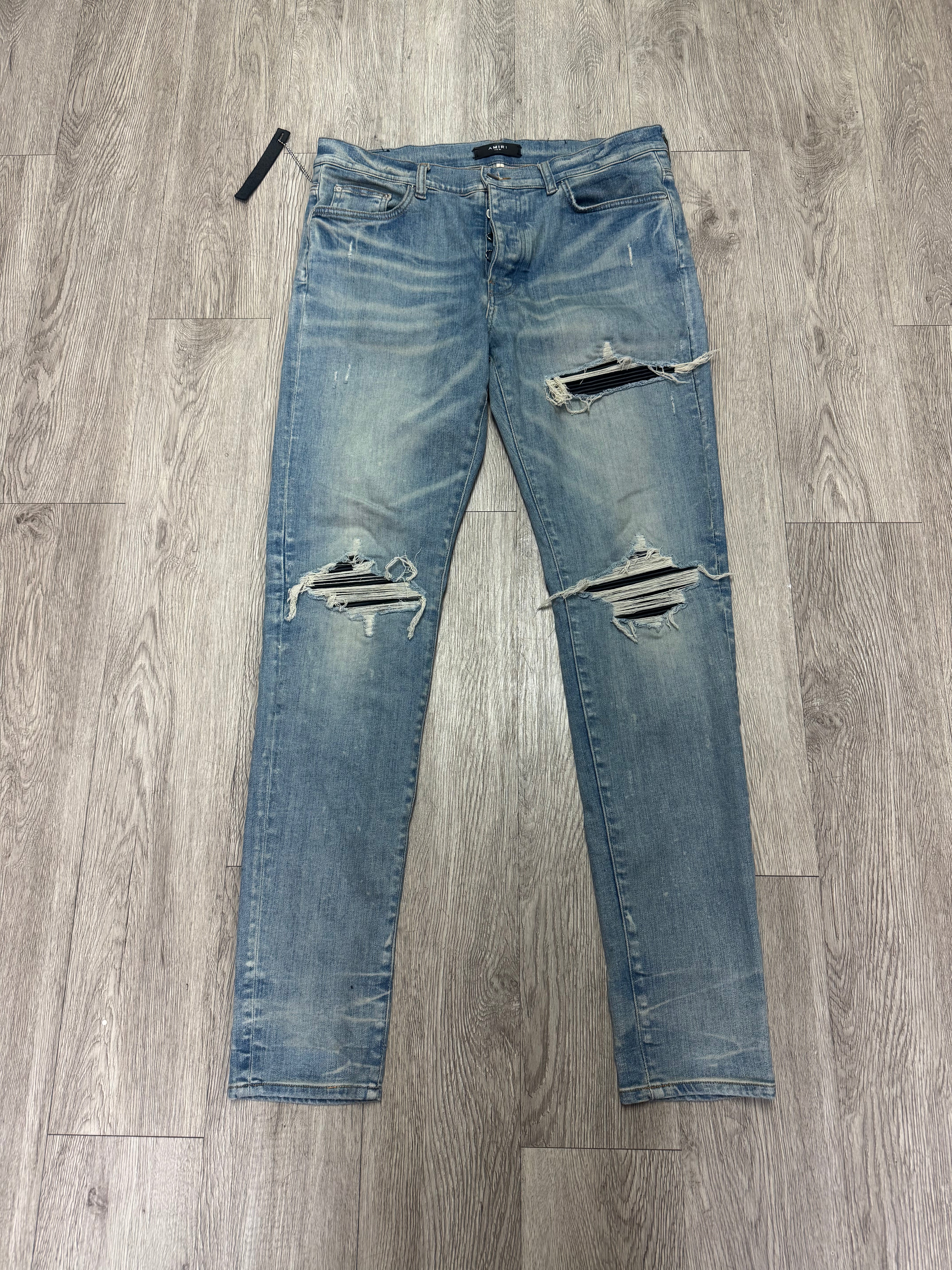 Amiri MX1 Light Wash Black Patch Jeans