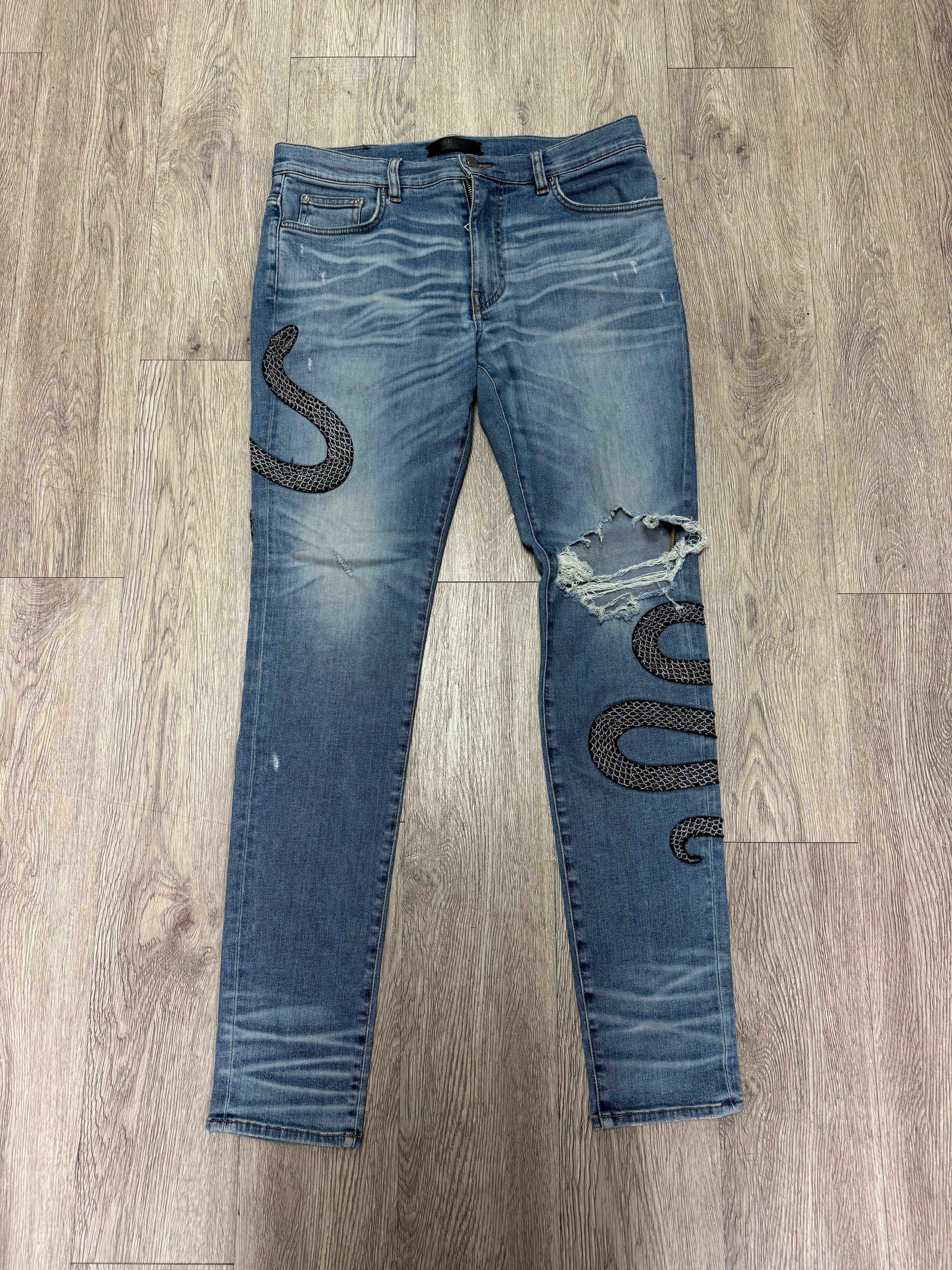 Amiri Light Wash Crystal Snake Jeans