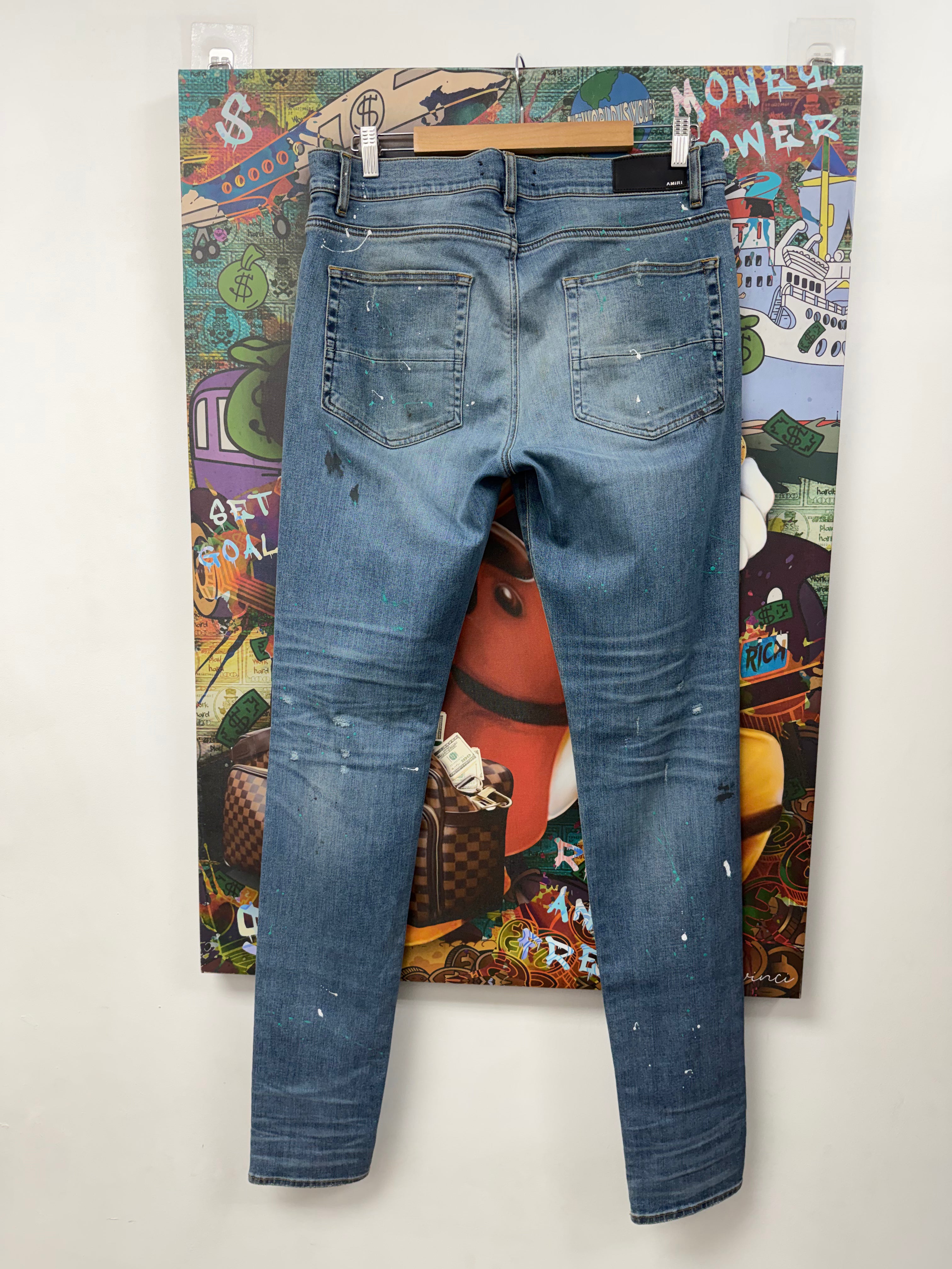 Amiri Light Wash Teal Splatter Ripped Jeans