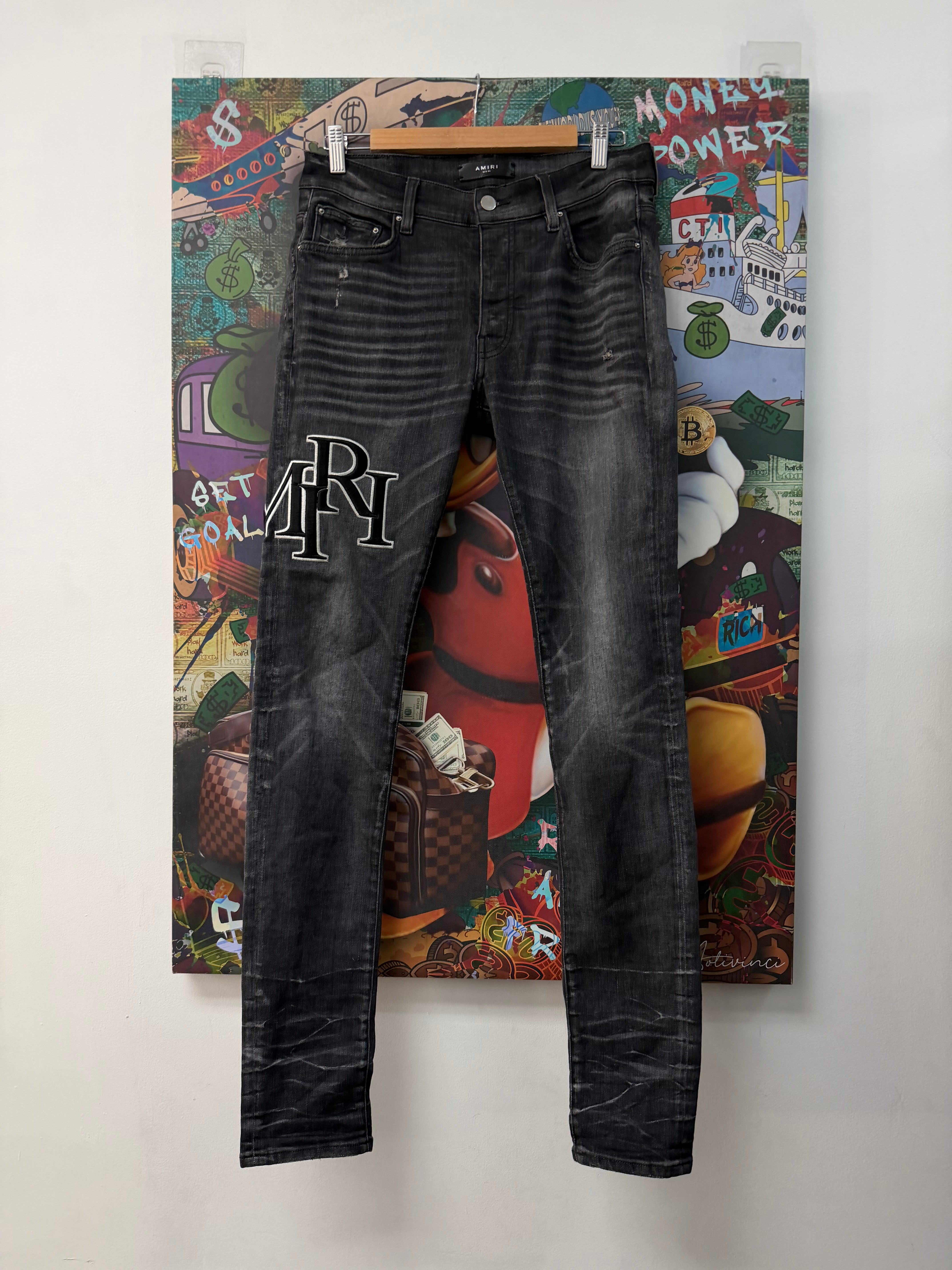 Amiri Black Staggered Logo Jeans