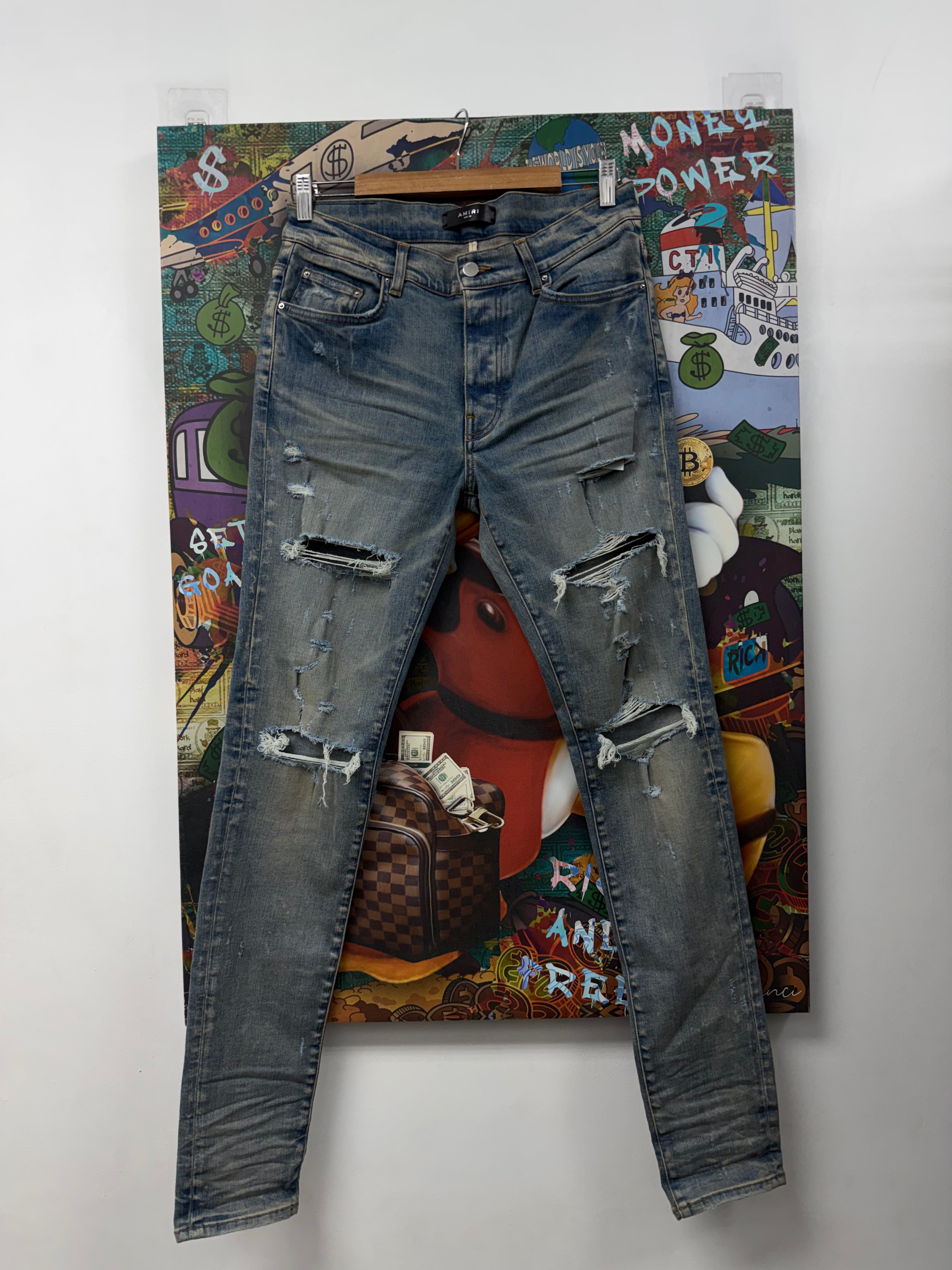 Amiri Light Wash Ripped Jeans