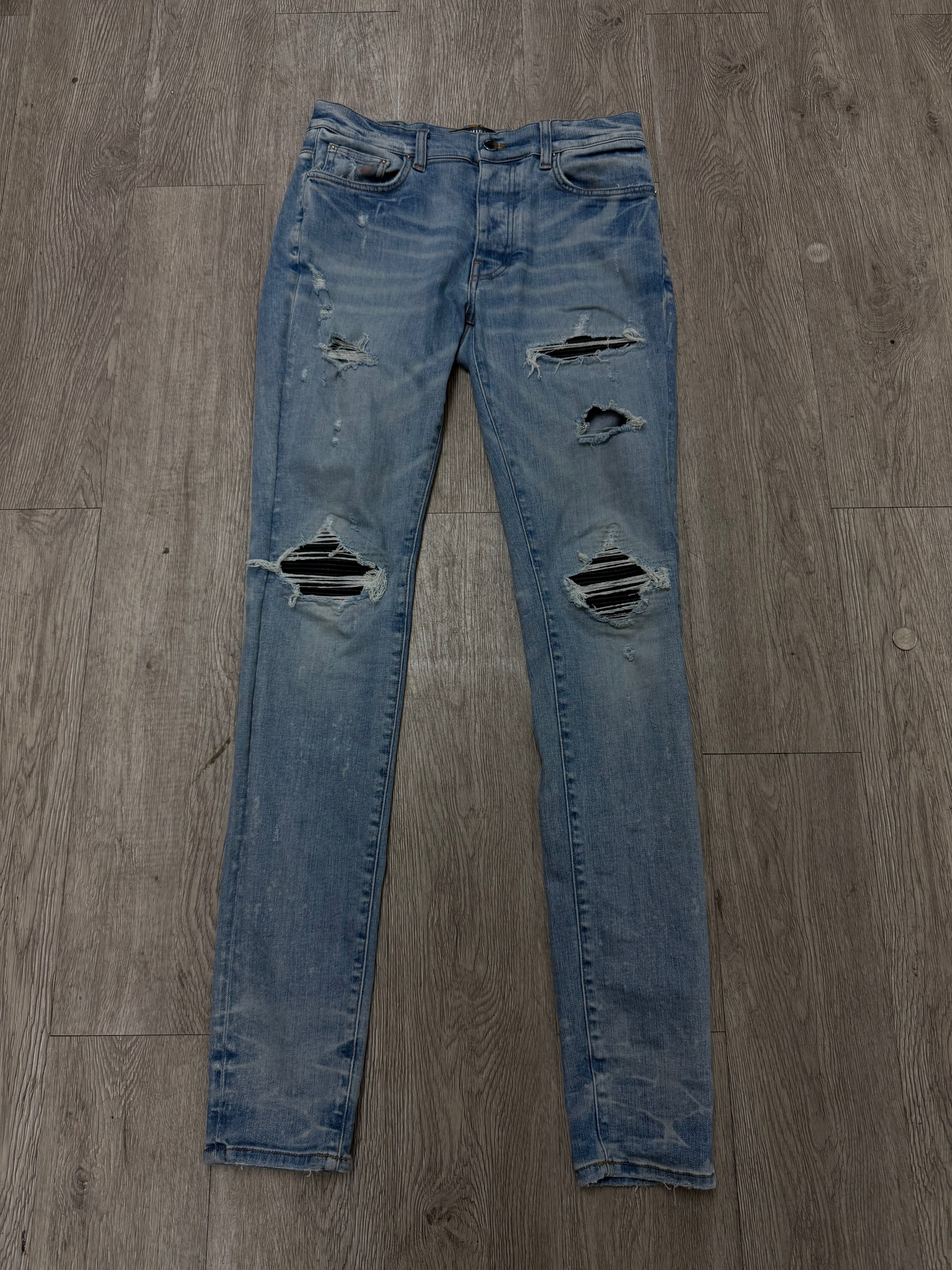 Amiri Mx1 Light Wash Black Patch Jeans