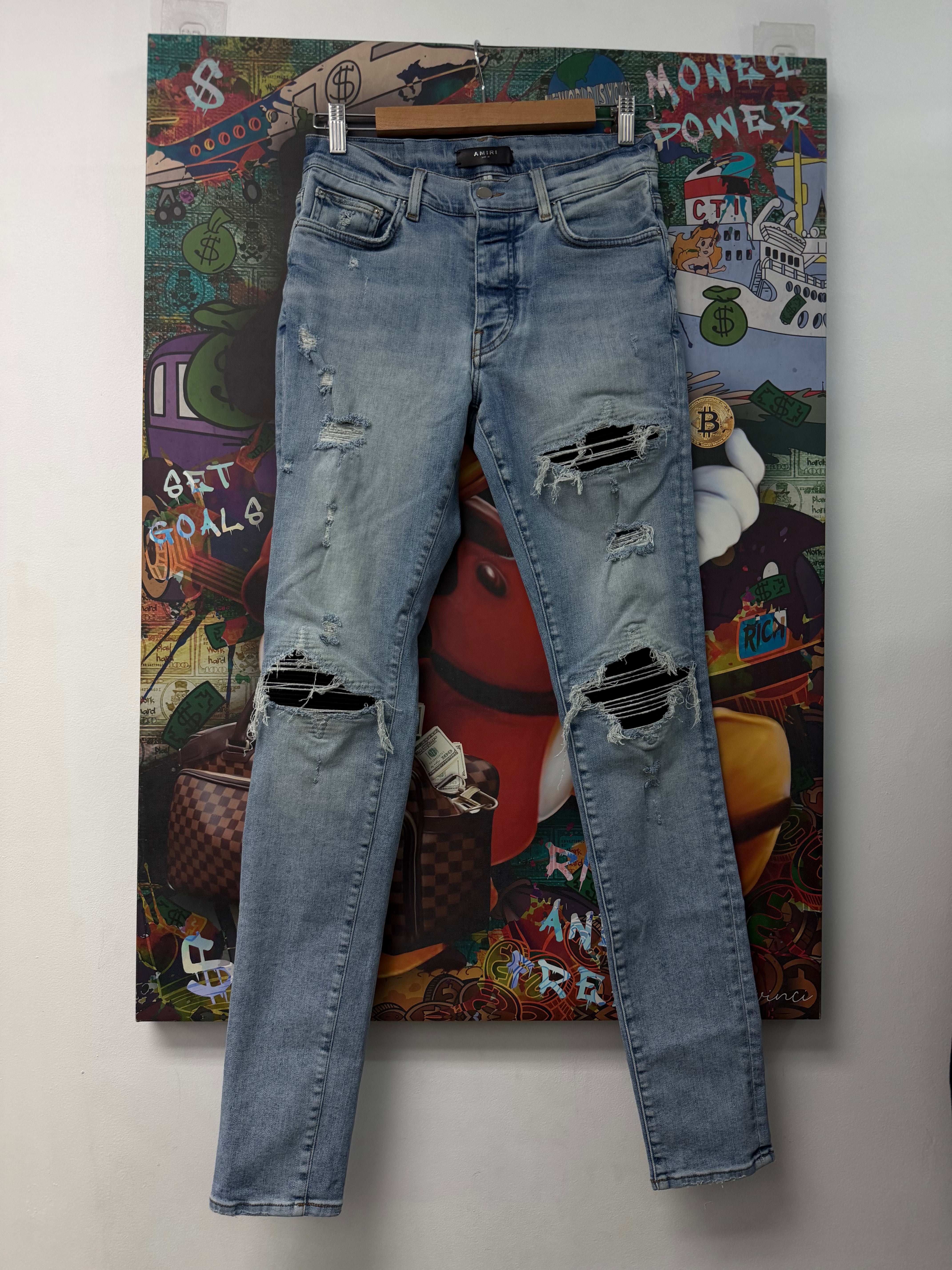 Amiri MX1 Light Wash Black Patch Jeans